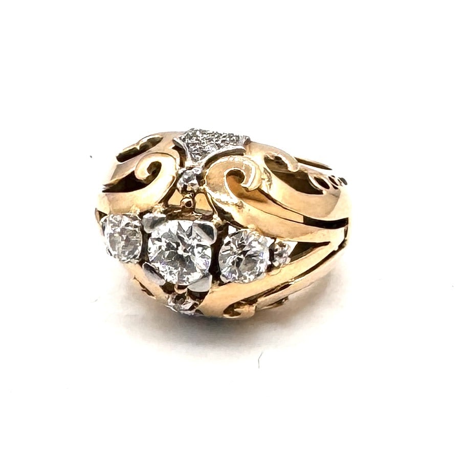 A STRIKING DIAMOND TWO-STONE DRESS RING An architectural asymmetric design in 18k gold: A modern and highly sculptural dress ring of significant presence, masterfully crafted in polished 18k yellow gold (750/1000). This piece features a bold, asymmetric crossover silhouette, characterize