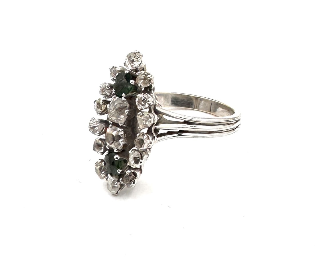AN IMPORTANT EMERALD AND OLD-CUT DIAMOND "MARQUISE" RING A Belle Époque inspired navette cluster in: A magnificent and rare "Marquise" (or Navette) statement ring, masterfully crafted in 18k yellow gold (750/1000) with white gold settings to enhance the brilliance of the stones. This subst