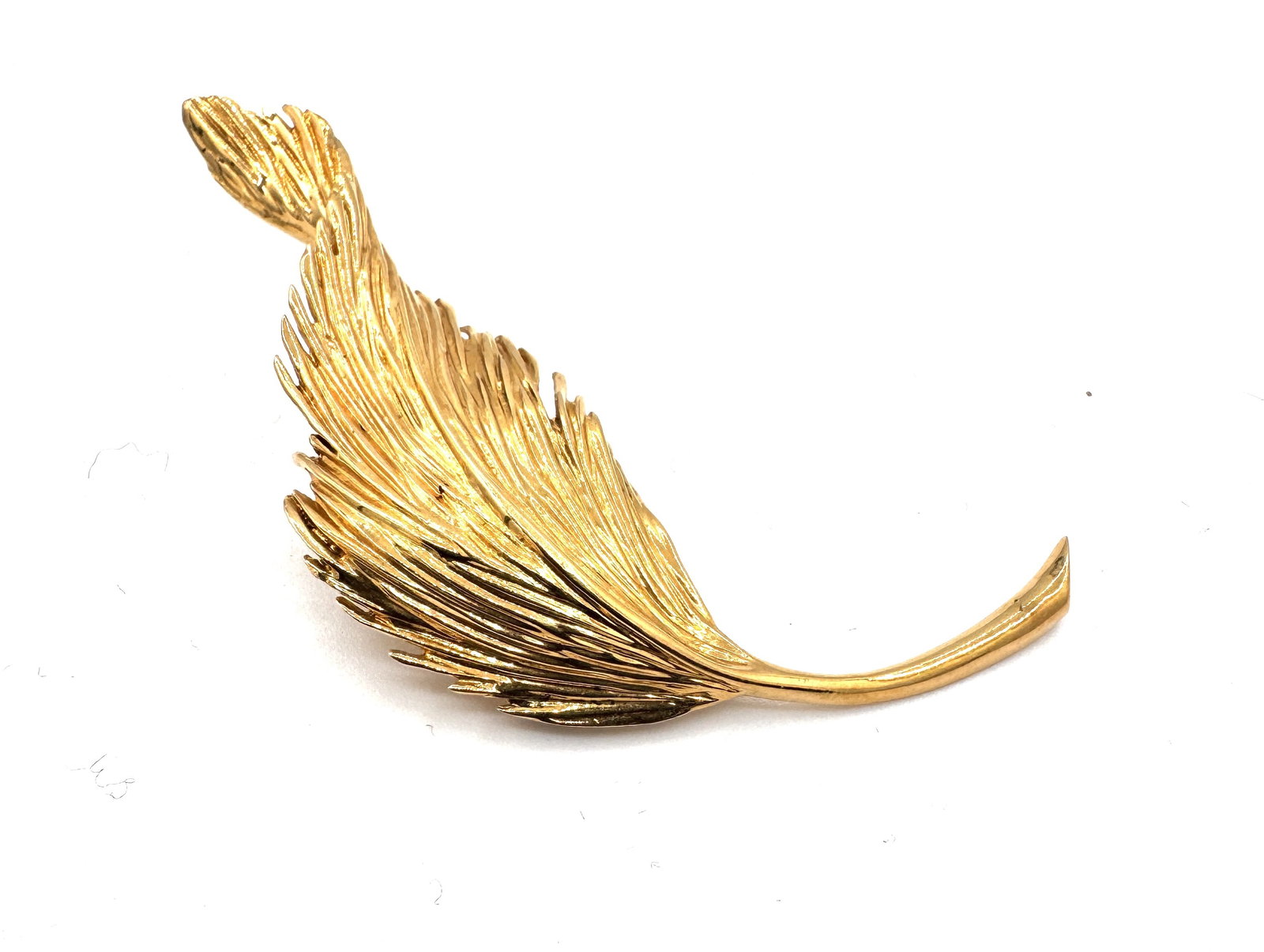 VAN CLEEF & ARPELS – A RARE RETRO "FEATHER" BROOCH, 1958 A masterwork of mid-century naturalist (1 of 2)