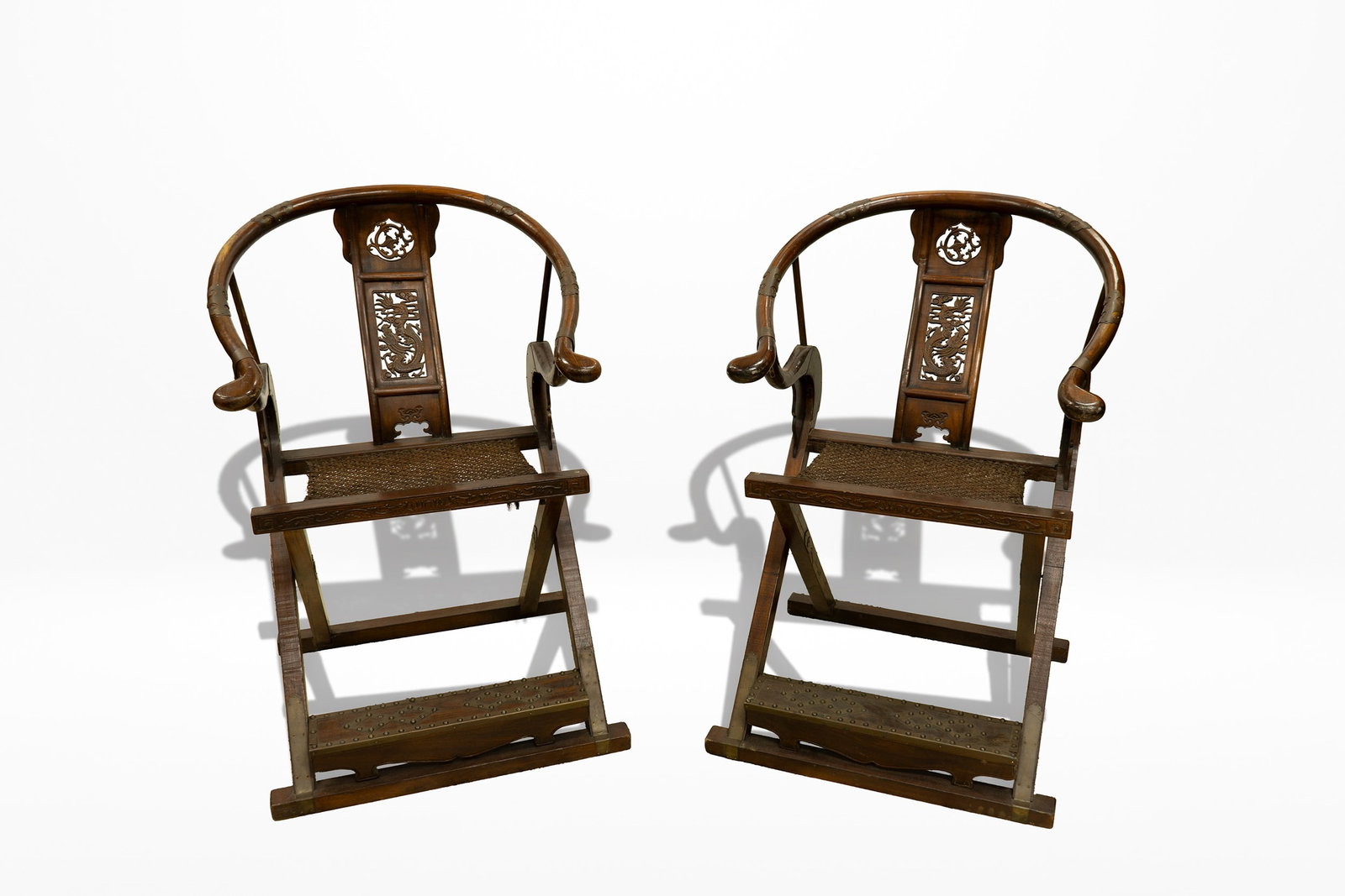 A Rare Pair of Chinese Folding Horseshoe-Back Armchairs (Jiaoyi) China,Late Qing Dynasty (Late 19th: This pair of late 19th-century