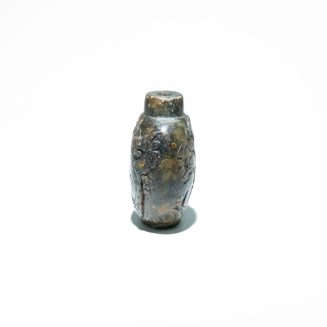 Chinese stone carved snuff bottle Qing Dynasty (1644-1911): It features intricate relief carvings, which commonly depict traditional motifs like