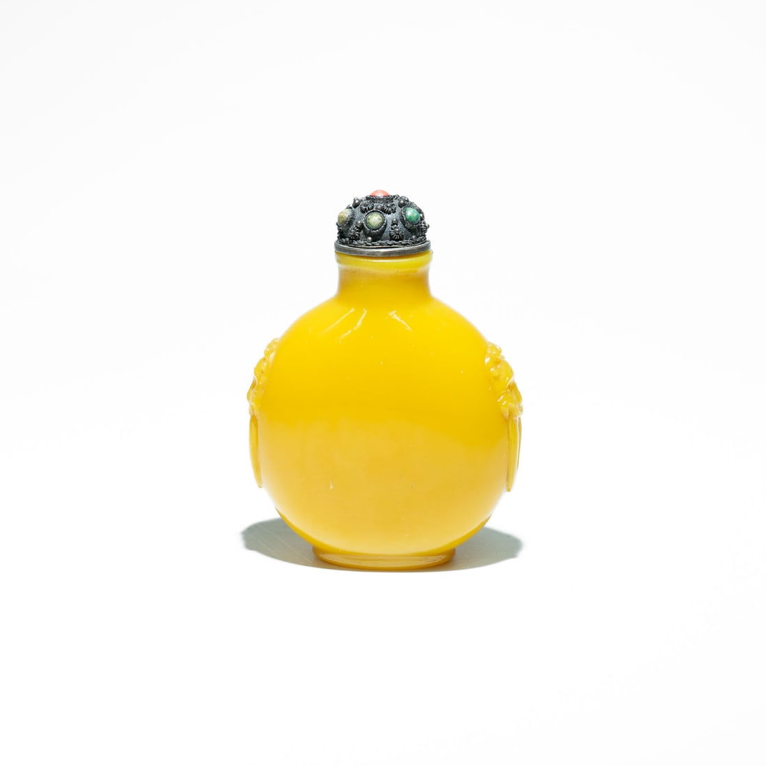 Chinese Peking Glass Snuff Bottle 20th Century: The bottle features characteristics typical of collector's pieces, often associated with historical periods in China: The vibrant yellow shade is often referred to as "Imperial Yellow" and is likely m