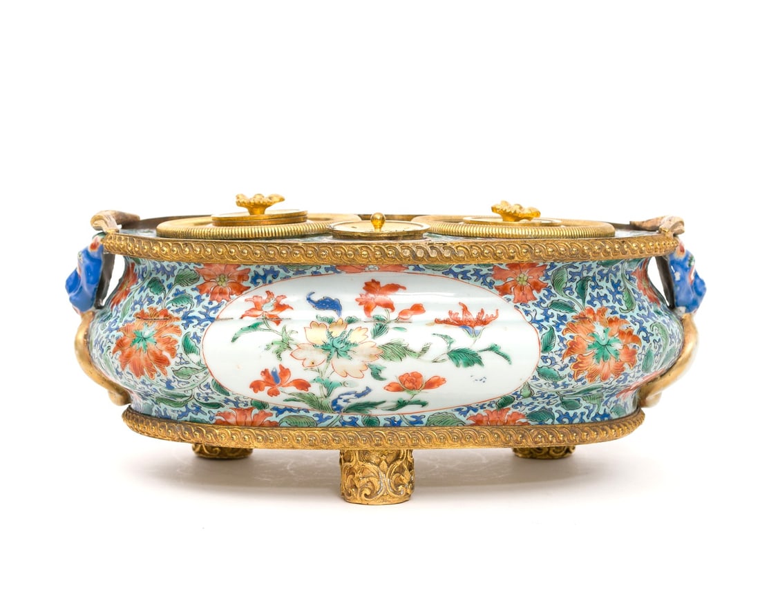 A 'Famille Verte' Porcelain Inkstand With European Gilt-bronze Mounts China, Qing Dynasty, Kangxi: This rare and sophisticated inkstand is composed of Kangxi period famille verte porcelain elements, masterfully integrated into a European gilt-bronze (ormolu) structure. The porcelain components are 