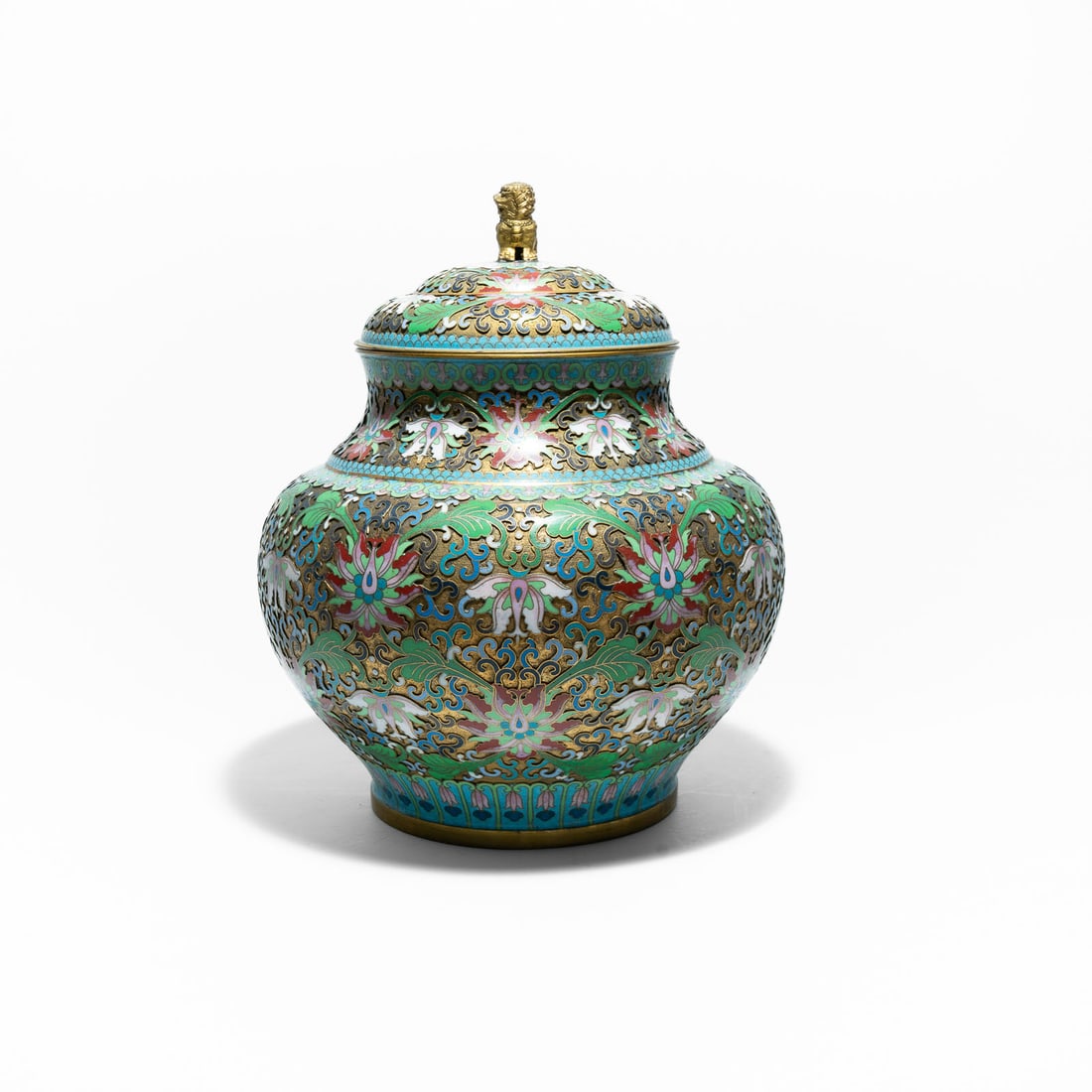 Chinese cloisonné ginger jar (also referred to as an urn or lidded vase) Late Qing Dynasty or the: It uses cloisonné (or sometimes champlevé), where wire filaments are soldered to a metal body (usually brass or bronze) to create compartments that are then filled with colored enamel paste and fire