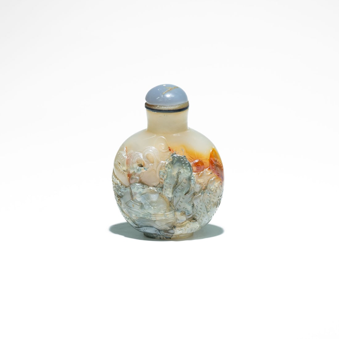 Chinese Agate Cameo carved Snuff Bottle Qing Dynasty(1644-1912): Known as qiaodiao("adopting the most suitable design"), the carver uses the darker, opaque outer layers (often russet, brown, or black) to create figures in high relief against the translucent gray or