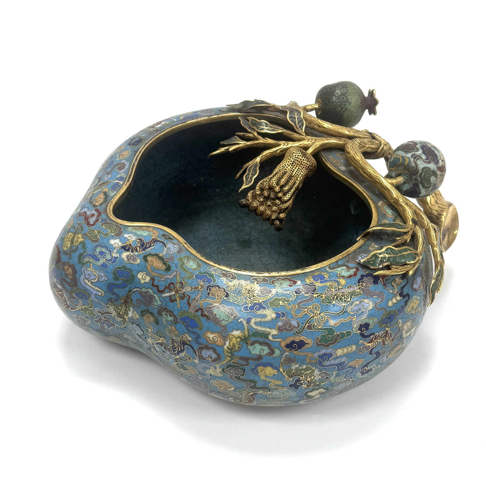 A Cloisonné Enamel and Gilt-Bronze 'Peach' Basin China, Qing dynasty (1644-1911): The basin is elegantly cast in the form of a large, compressed peach, a traditional symbol of longevity. The interior and exterior are finely decorated in cloisonné enamels with a vibrant palette, fe
