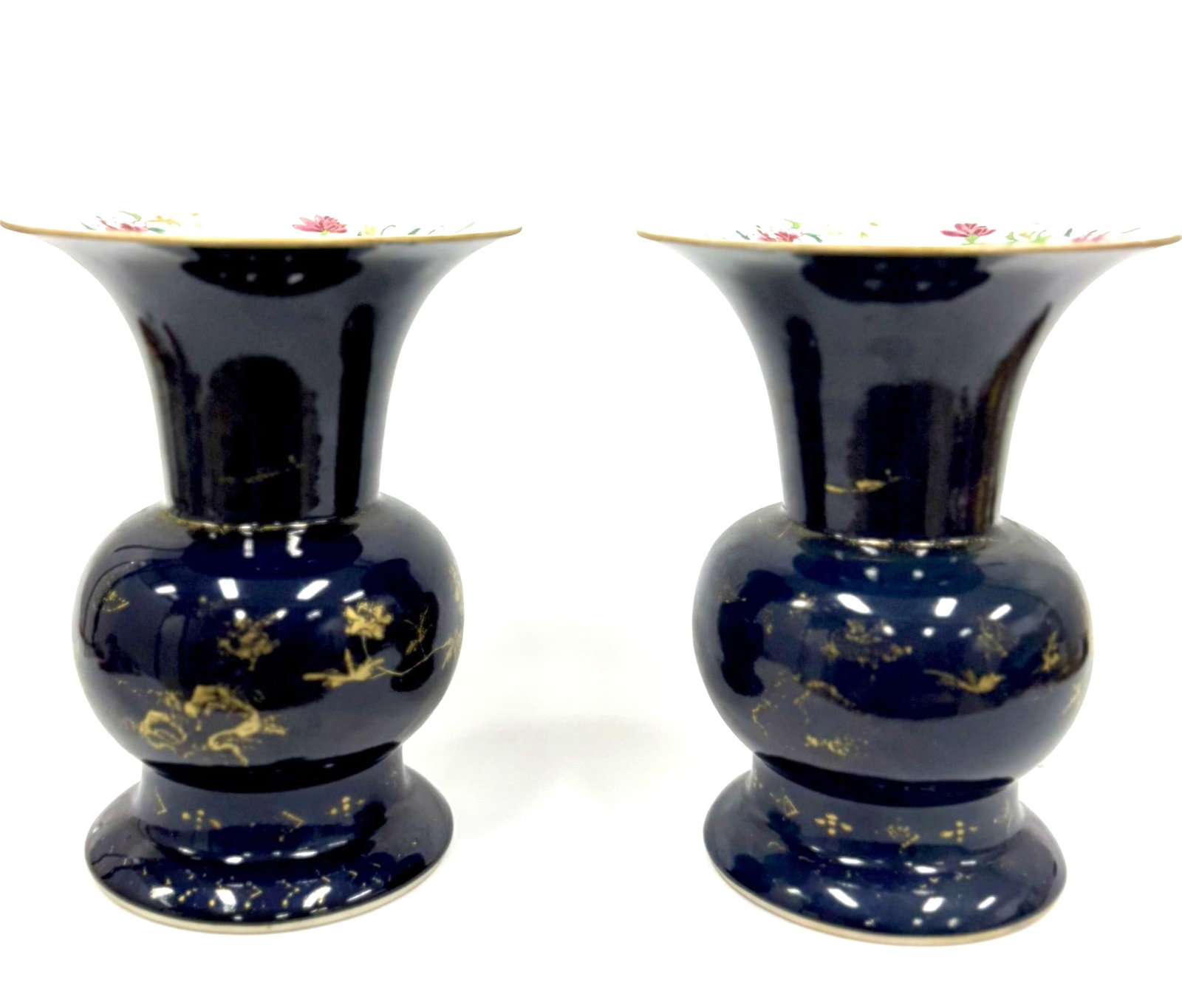A pair of powder blue ground and famille rose porcelain "Zhadou" vases China, Qing Dynasty (1644 -: This elegantly proportioned porcelain vase features a globular body rising to a long, slightly flared neck. The exterior is enveloped in a deep, mottled powder-blue glaze, expertly embellished with fi