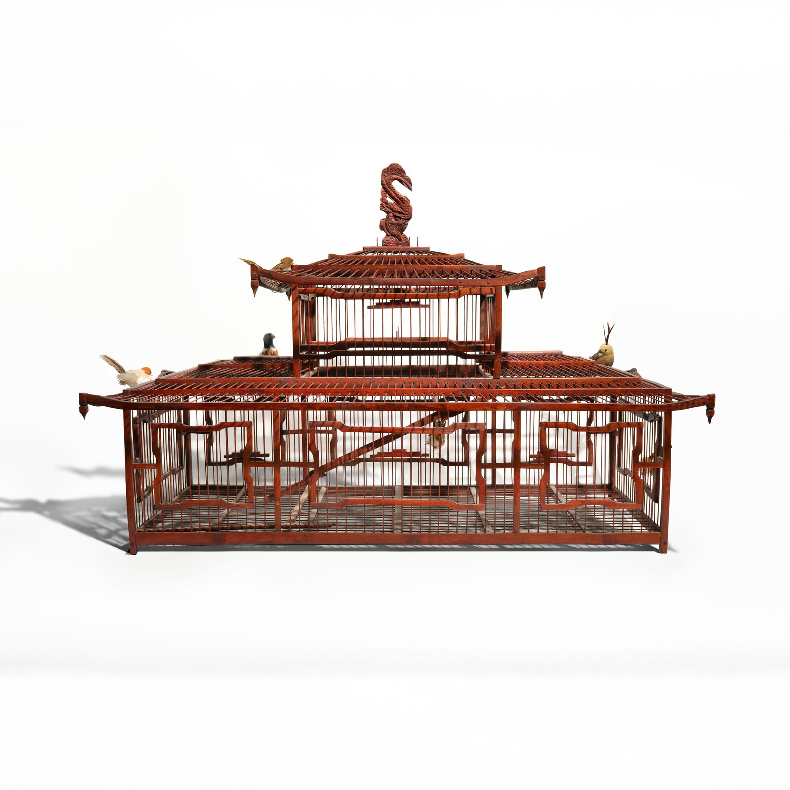 A Large And Finely Constructed Bamboo bird Cage China, Qing Dynasty / Early Republic period, circa: This large-scale cage is masterfully crafted from split and bent bamboo, exhibiting the intricate joinery and architectural elegance characteristic of Chinese bamboo-work from the turn of the 20th cen