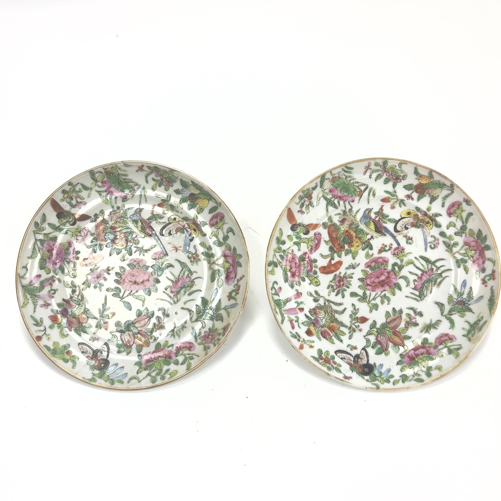 A Fine White-ground 'Famille Rose' Porcelain Plate China, Qing Dynasty, 19th century: This porcelain plate is brightly decorated on a clear, white-glazed ground, featuring a complex and vibrant composition in the famille rose palette. The central narrative medallion depicts a domestic 