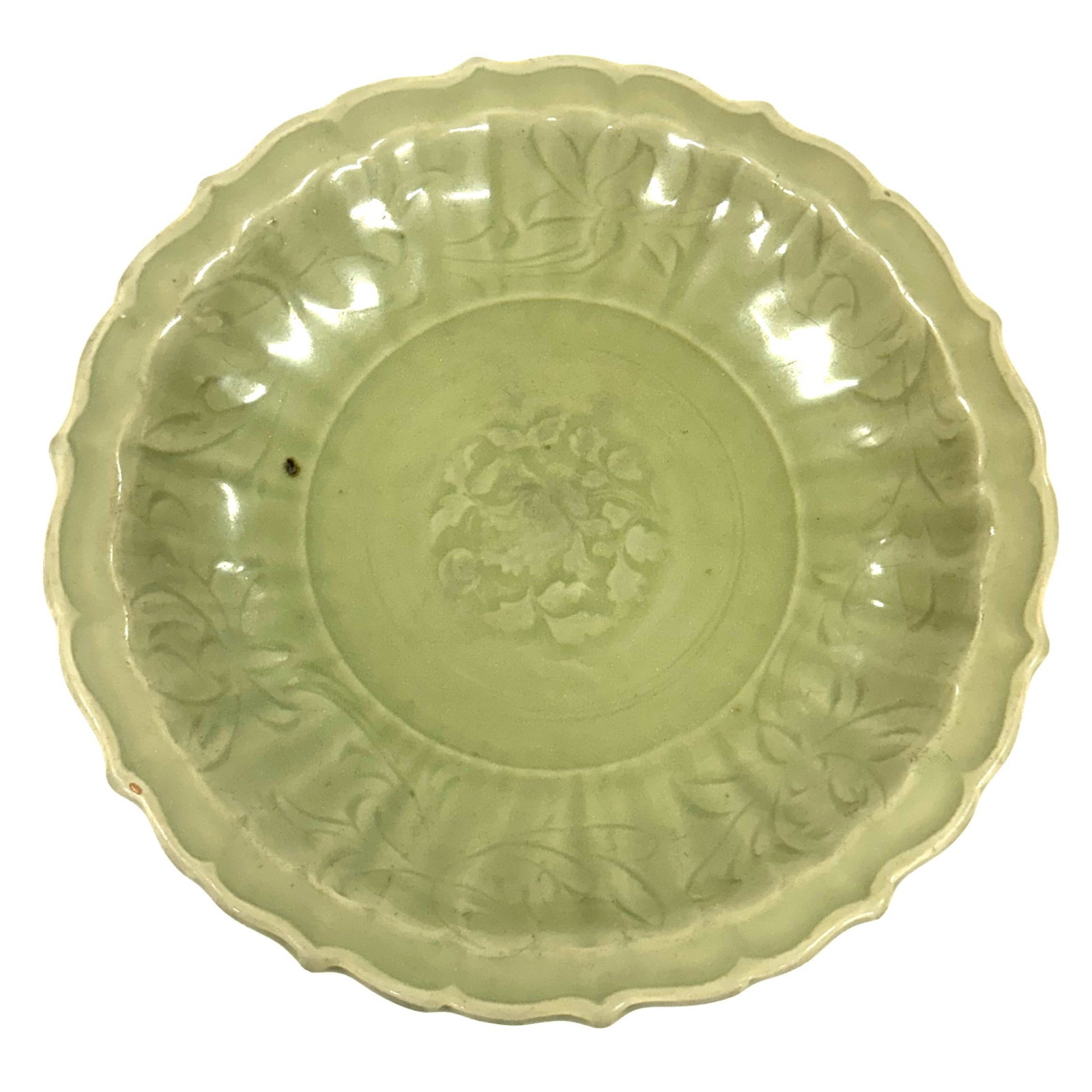 A large Longquan celadon "lotus" dish China, Yuan to Early Ming Dynasty.: The heavily potted dish features rounded sides rising from a short tapered