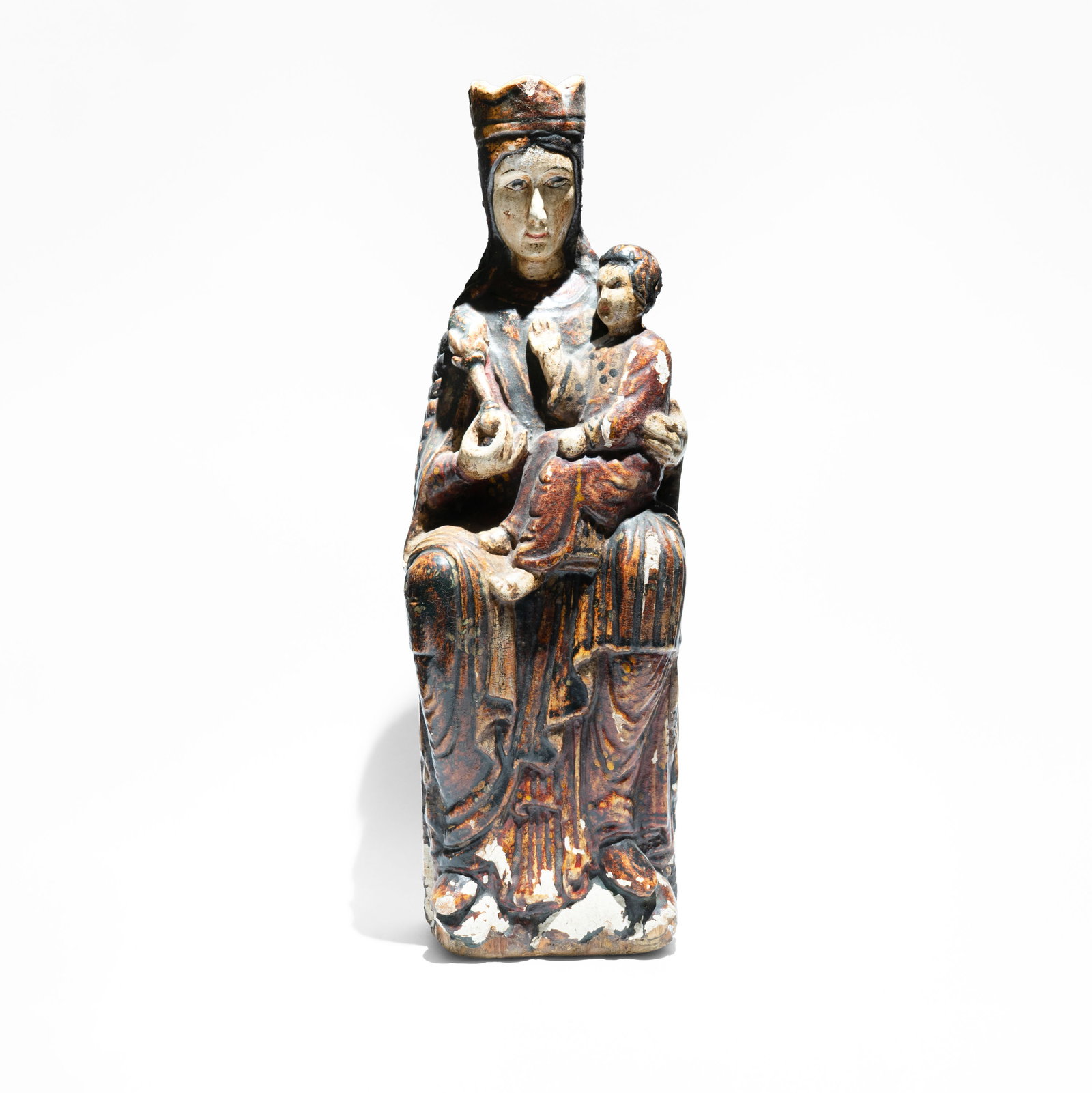A wooden and polychromed Virgin in Majesty "Sedes Sapientiae" Probably Spanish, Romanesque Style,: The Virgin Mary is depicted sitting in a rigid, frontal position, serving as the physical throne for the Christ Child. This posture symbolizes Jesus as the personification of Divine Wisdom. The piece 
