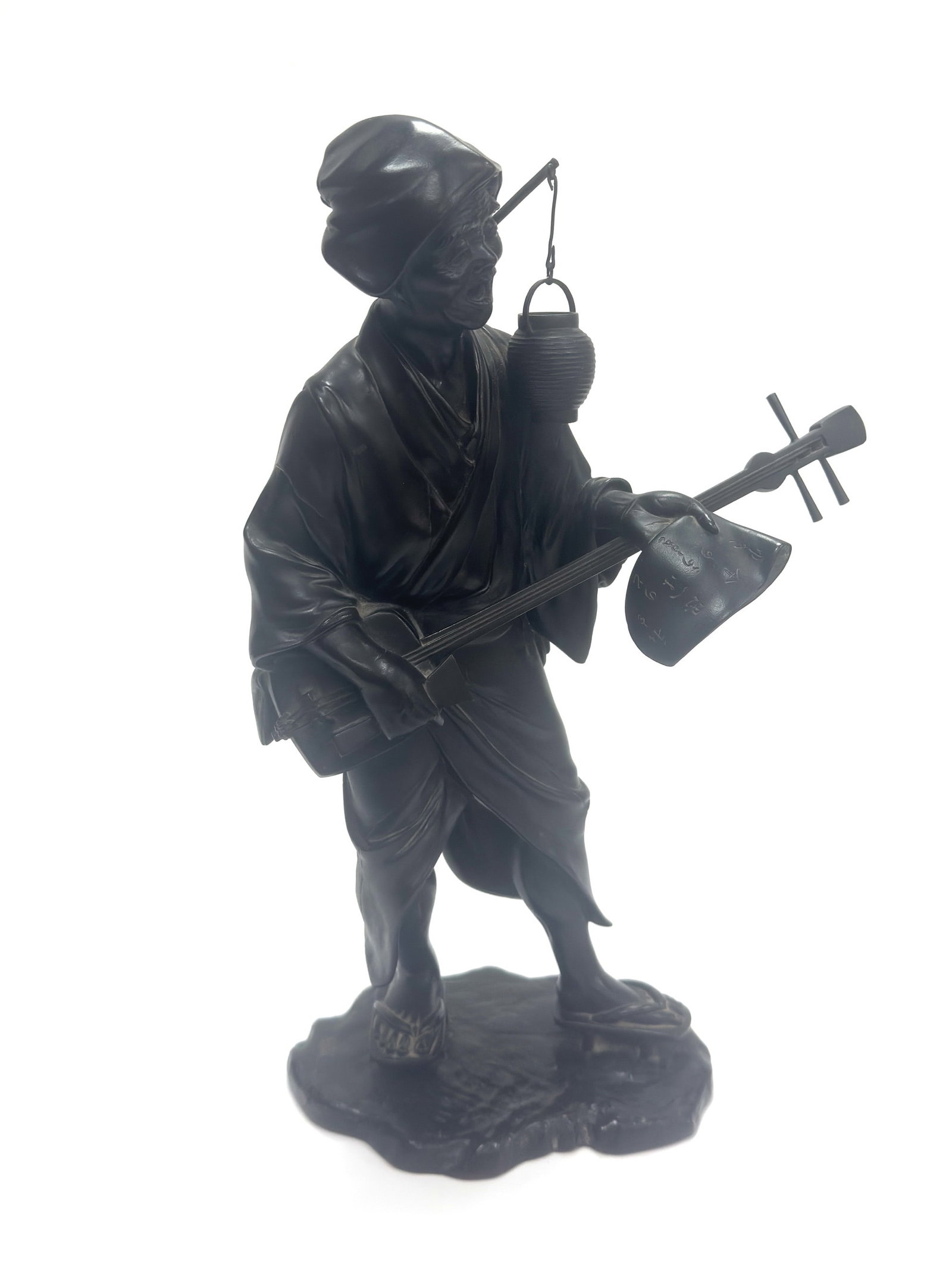 A Dark Patinated Bronze Figure of a Traveling Shamisen Player Japan, Meiji Period (1868–1912) (1 of 2)
