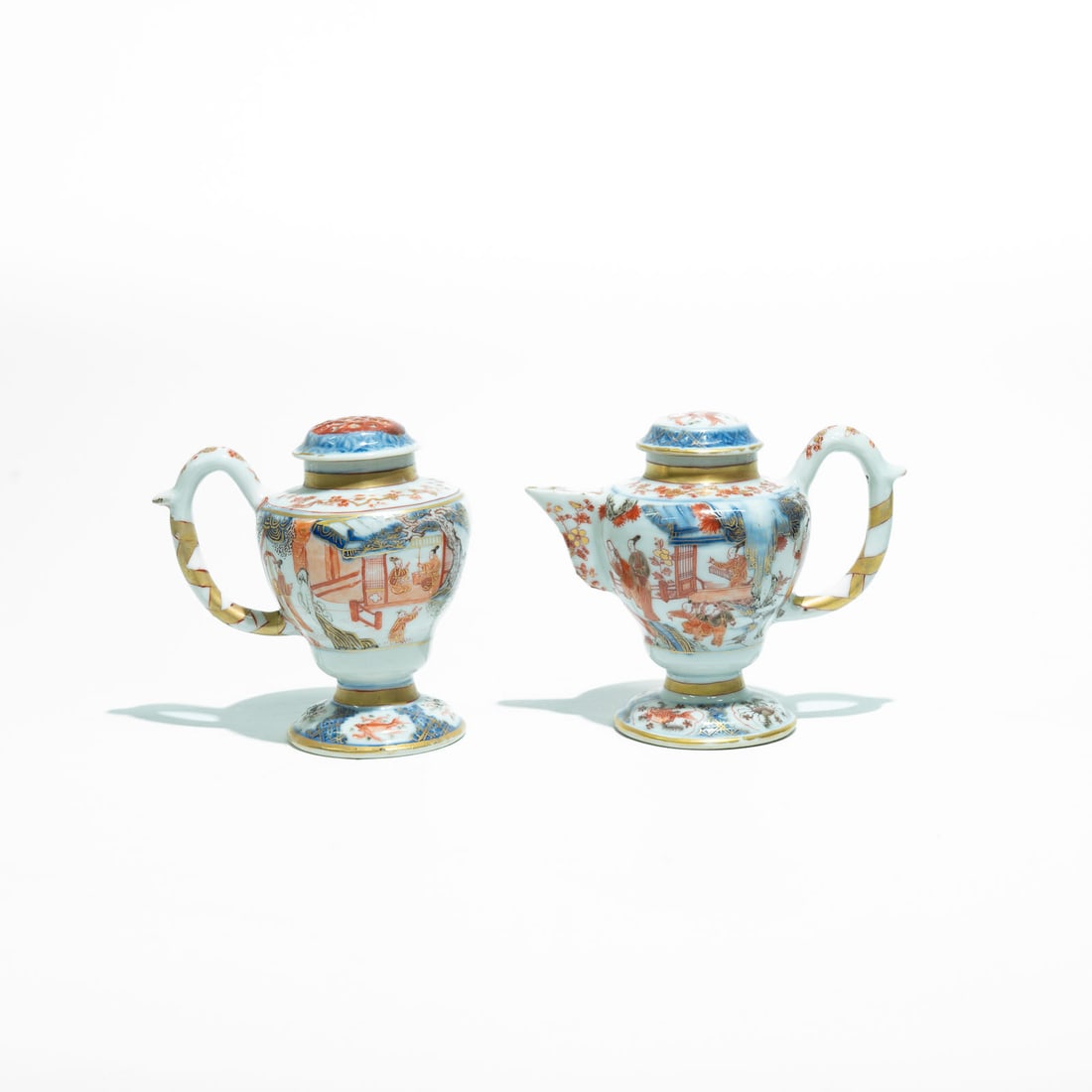 Pair of oil lamps made of Chinese export porcelain, Imari decoration Kangxi: They feature the signature palette of Chinese Imari porcelain, produced largely for the European market starting in the 18th century. This style combines underglaze cobalt blue with overglaze iron-red