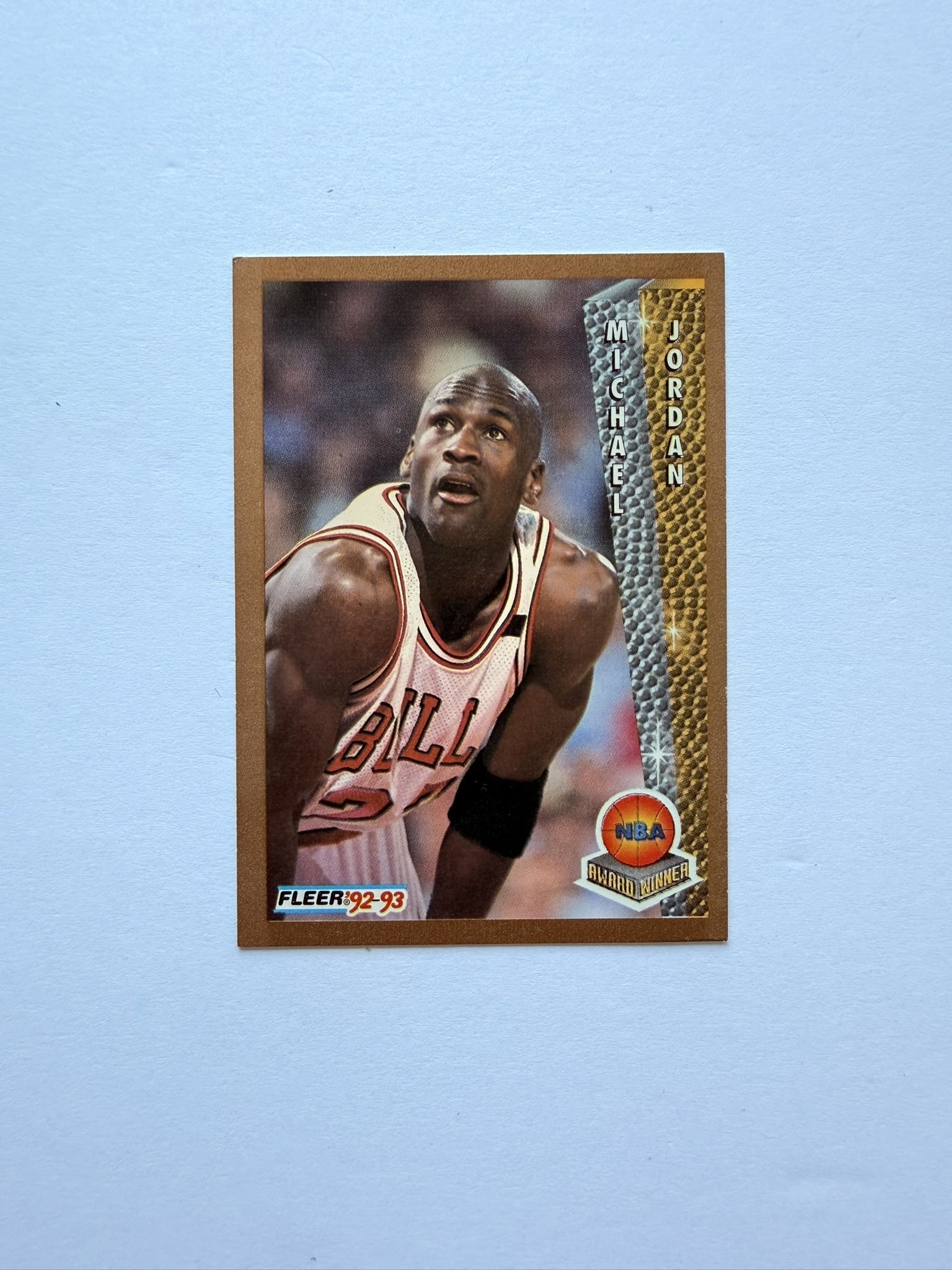 Michael Jordan Fleer 92 93 Award Winner Chicago Bulls Card: Michael Jordan Fleer 1992-93 Award Winner basketball card featuring the Chicago Bulls legend. Classic vintage era Jordan collectible with sharp action photography and gold border design.