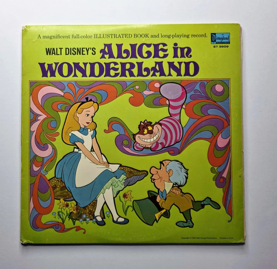 Vintage Walt Disney’s Alice in Wonderland Disneyland Record ST-3909: Vintage Disneyland Records Alice in Wonderland illustrated book and long-playing record featuring colorful psychedelic-style artwork.