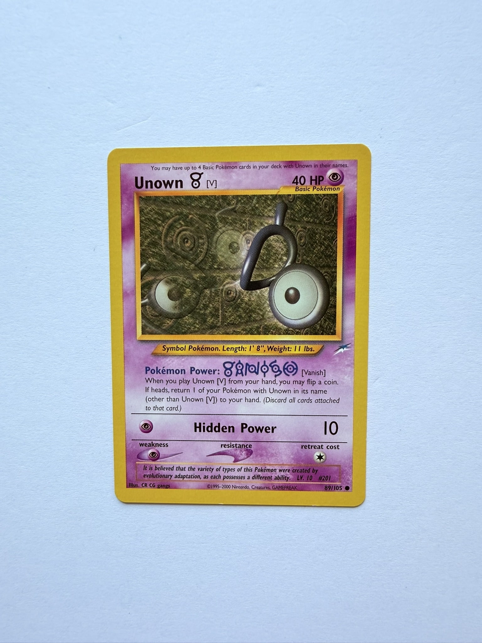 Pokemon Unown V 89/105 Neo Destiny Vintage WOTC Card: Vintage Pokémon Unown [V] from the Neo Destiny set. Classic Wizards of the Coast era collectible featuring the iconic Unown alphabet series.