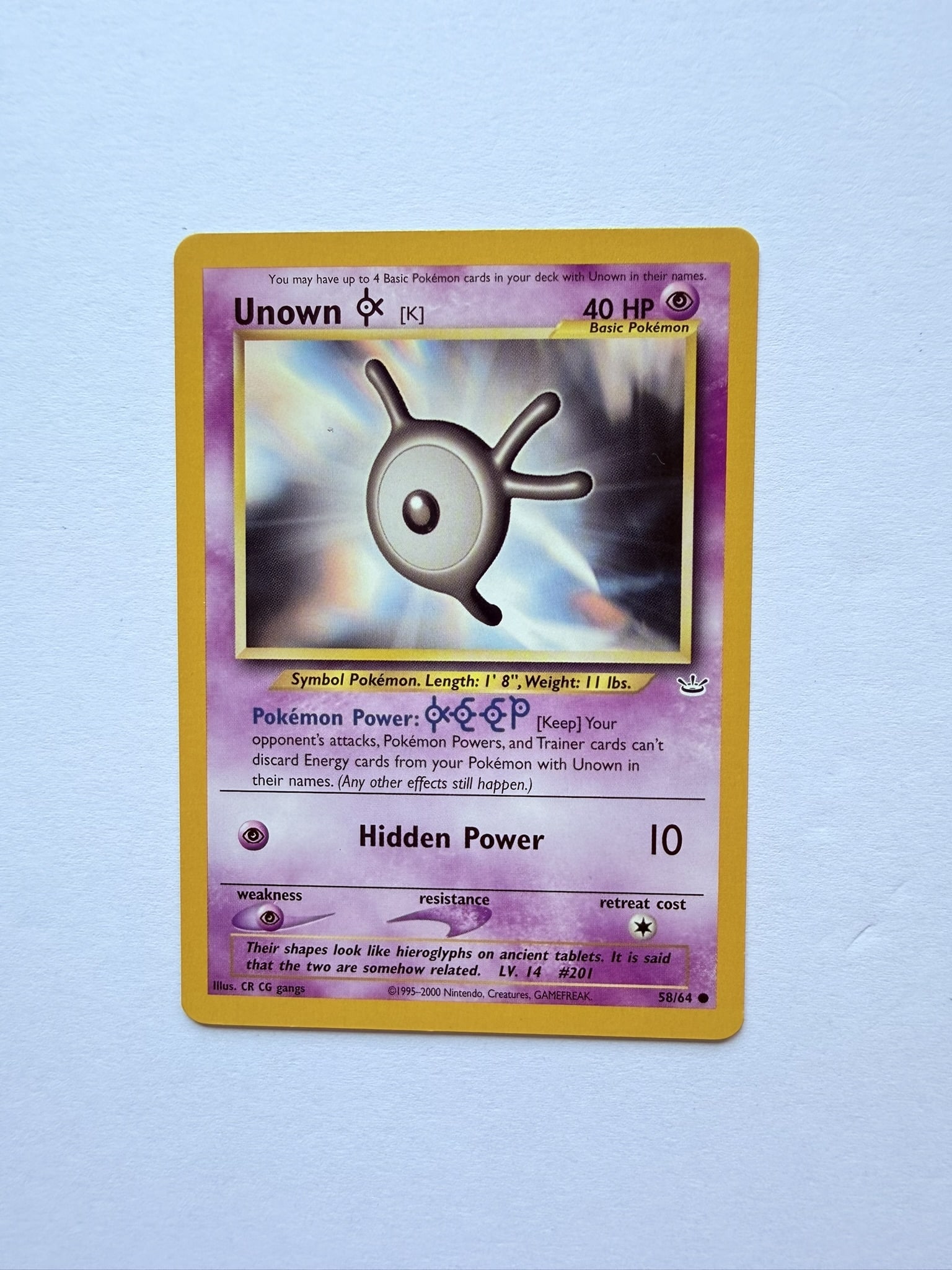 Pokemon Unown K 58/64 Neo Revelation Vintage WOTC Card: Vintage Pokémon Unown [K] from the Neo Revelation set released during the Wizards of the Coast era.
