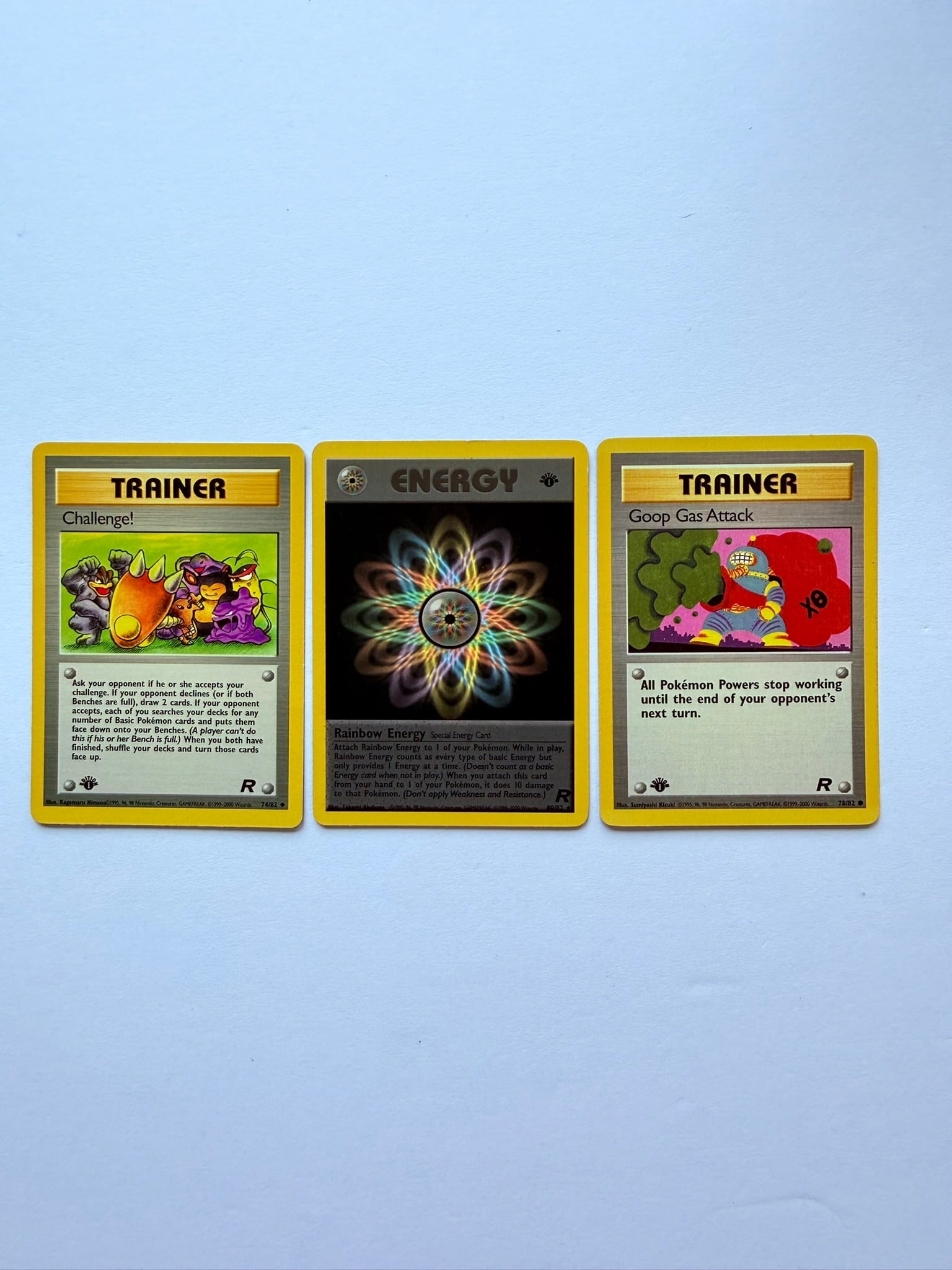 1st Edition Shadowless Pokemon Trainer Card Lot Rainbow Energy Challenge Goop Gas Attack: Vintage Pokemon Trainer card lot featuring Rainbow Energy, Challenge, and Goop Gas Attack from the original Wizards of the Coast era. Includes 1st Edition Shadowless cards, sold as shown.