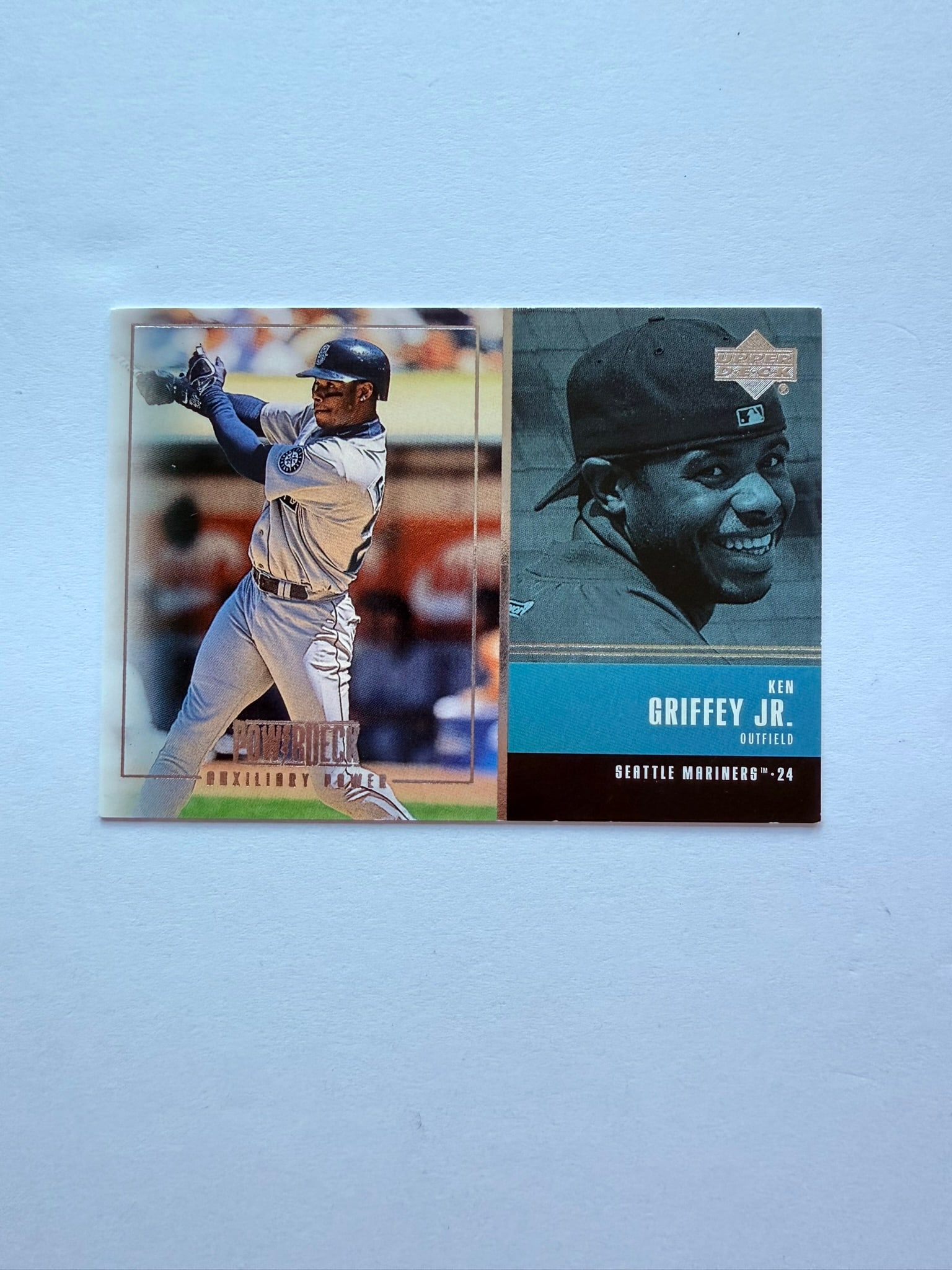 1999 Upper Deck “Auxiliary Power?? Ken Griffey Jr. AUX-1: Upper Deck Ken Griffey Jr. insert with dual-image layout and career stat highlights on back. Popular late-90s Mariners collectible.
