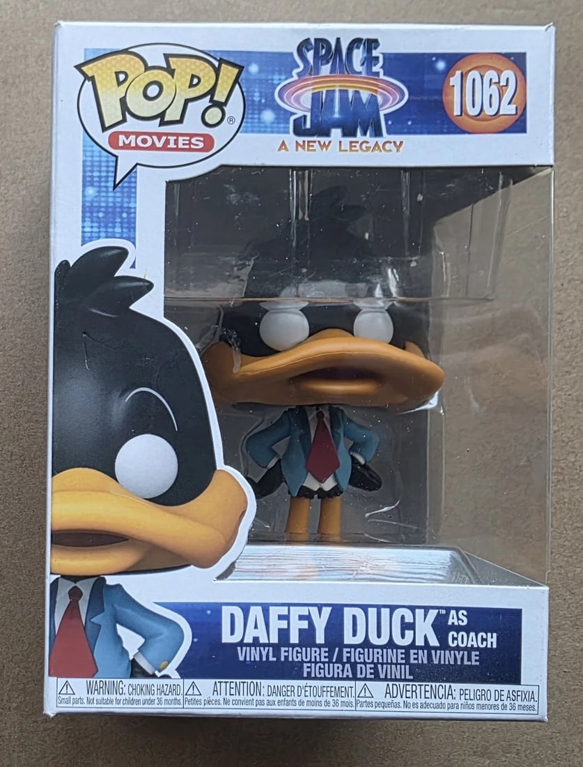 Funko Pop! Movies Space Jam Daffy Duck As Coach #1062 Vinyl Figure: Funko Pop! Movies Space Jam Daffy Duck As Coach #1062 vinyl figure. Fun collectible featuring the classic Looney Tunes character.