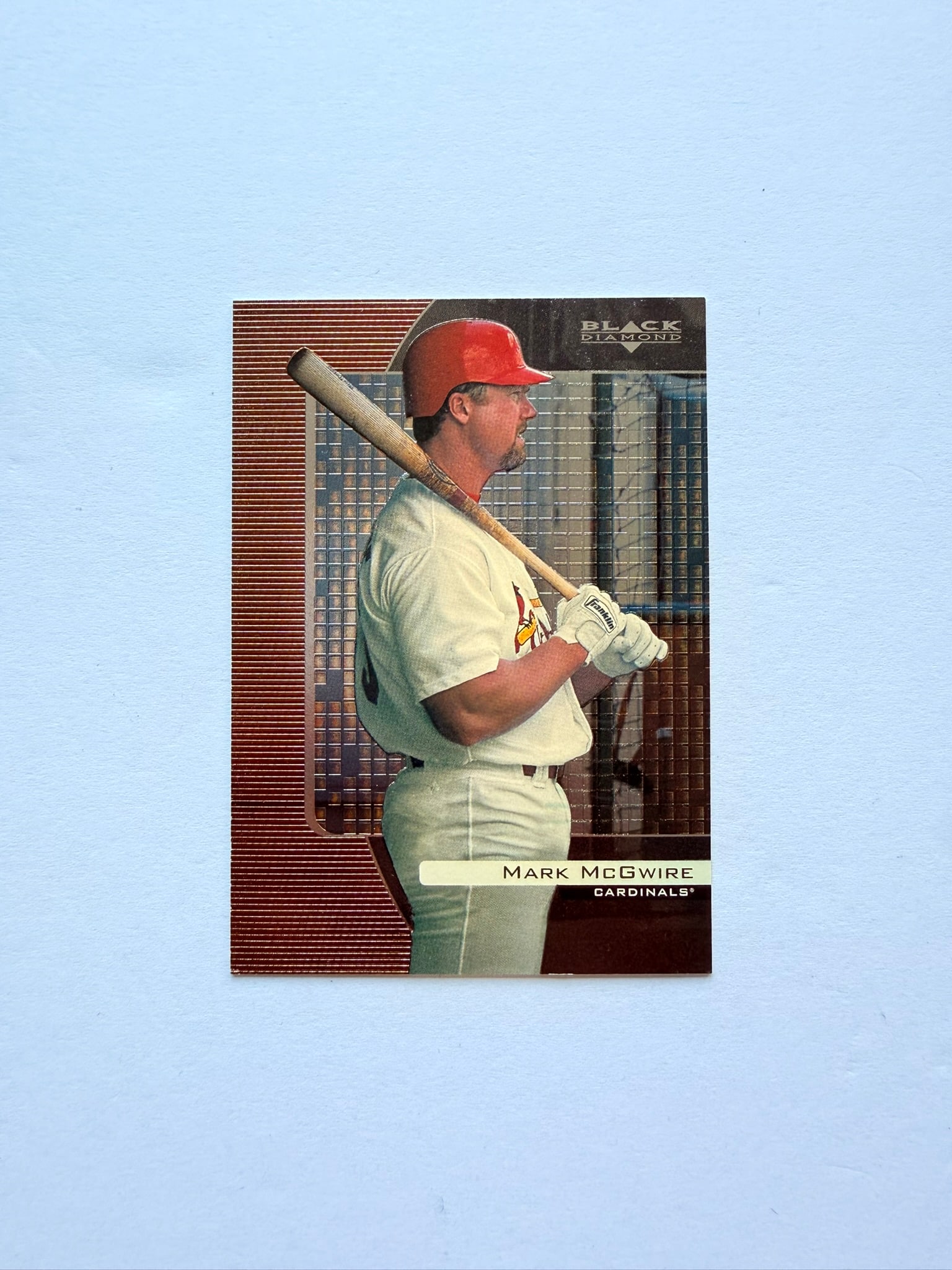 1999 Upper Deck Black Diamond Mark McGwire #80: 1999 Upper Deck Black Diamond Mark McGwire card featuring the legendary St. Louis Cardinals slugger during the peak of the home run era. Premium late-90s insert-style design with metallic