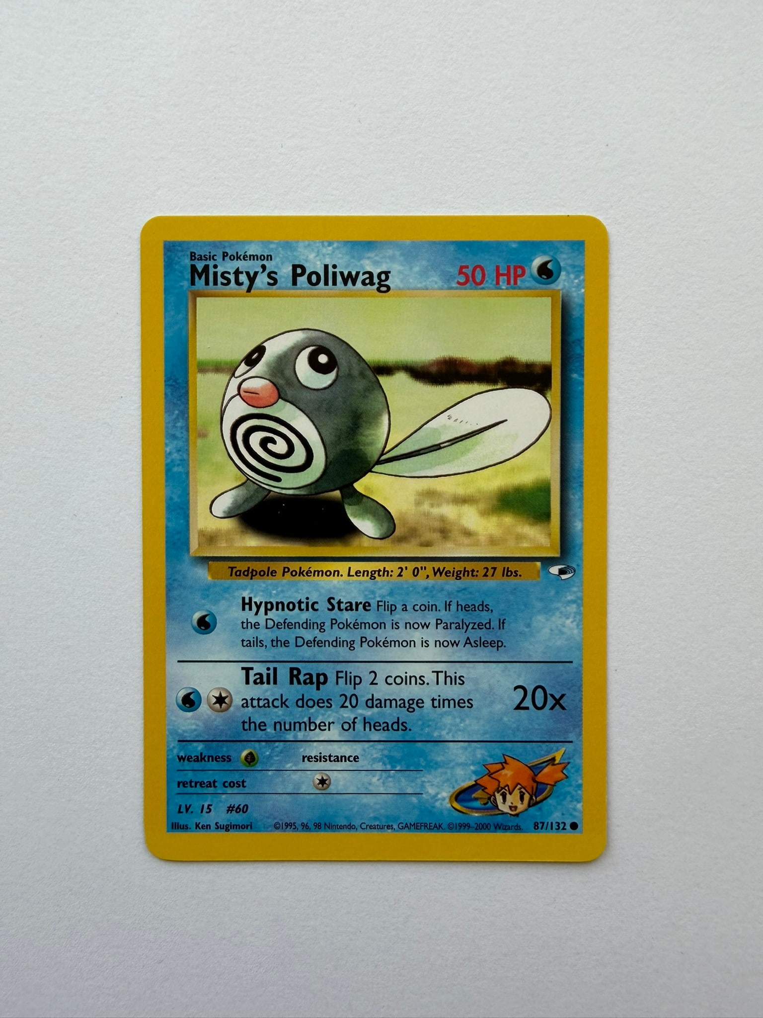 2000 Pokemon Misty's Poliwag 87/132 Gym Heroes: Misty's Poliwag 87/132 from the 2000 Pokemon Gym Heroes expansion. Unlimited non-holo common featuring classic Ken Sugimori artwork. Ungraded with visible edge and surface wear. Please review photogra