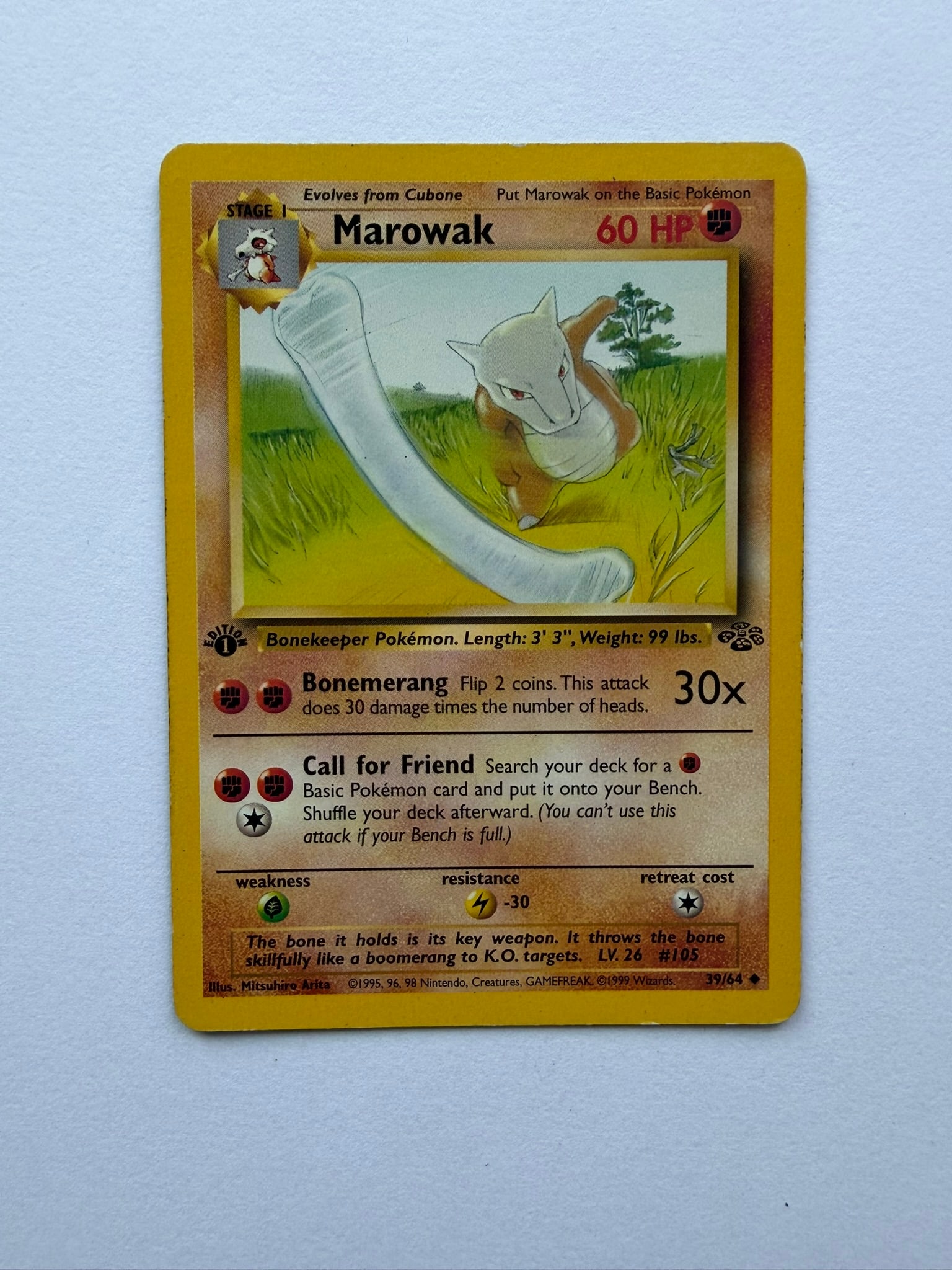 1999 Pokemon Marowak 39/64 Jungle 1st Edition: Vintage Marowak 39/64 from the 1999 Pokemon Jungle expansion. English 1st Edition non-holo uncommon featuring artwork by Mitsuhiro Arita. Ungraded with visible edge and surface wear. Please review pho