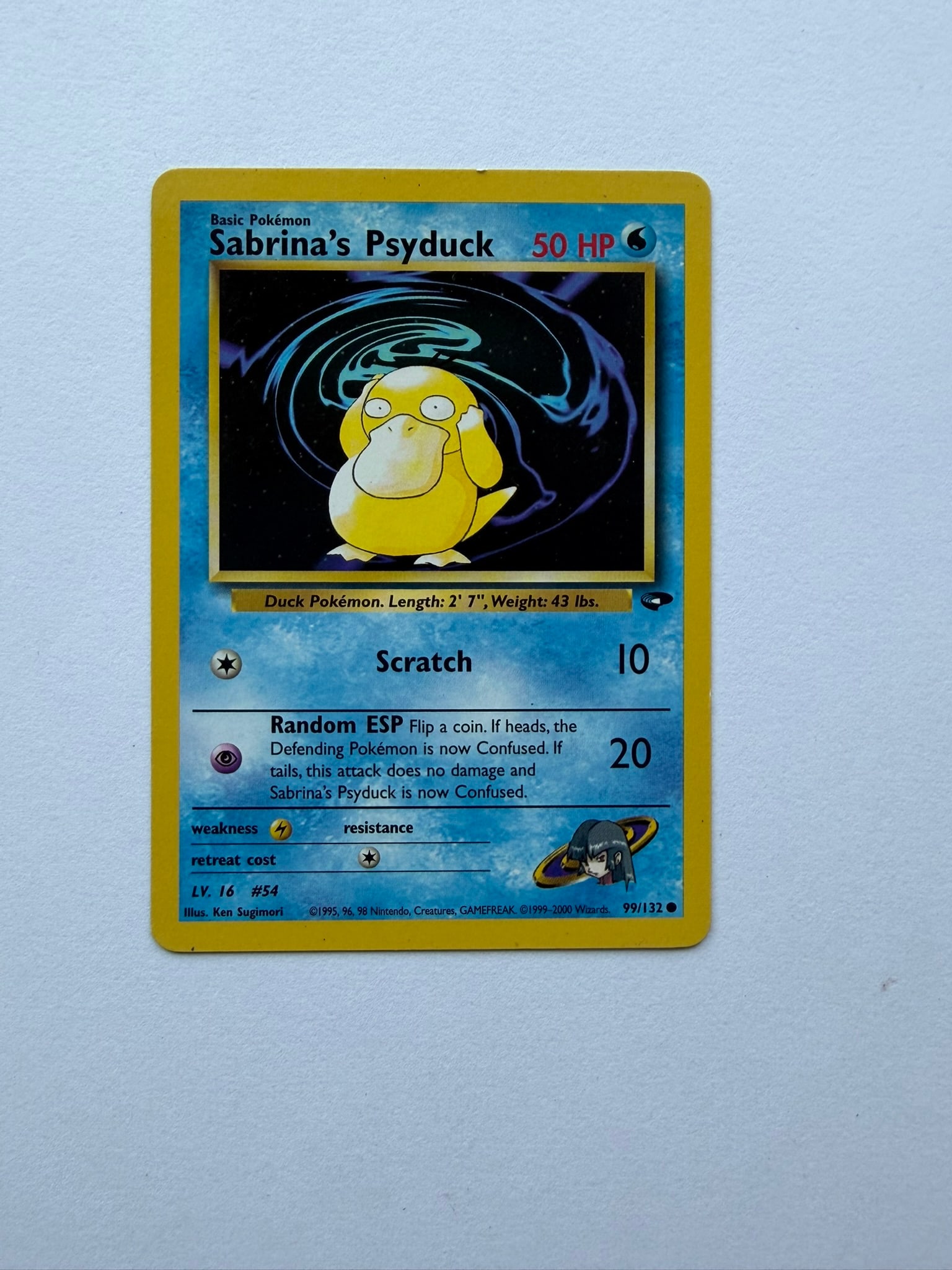 2000 Pokemon Sabrina's Psyduck 99/132 Gym Challenge: Sabrina's Psyduck 99/132 from the 2000 Pokemon Gym Challenge expansion. Unlimited non-holo common featuring classic Ken Sugimori artwork. Ungraded with visible edge and surface wear. Please review pho