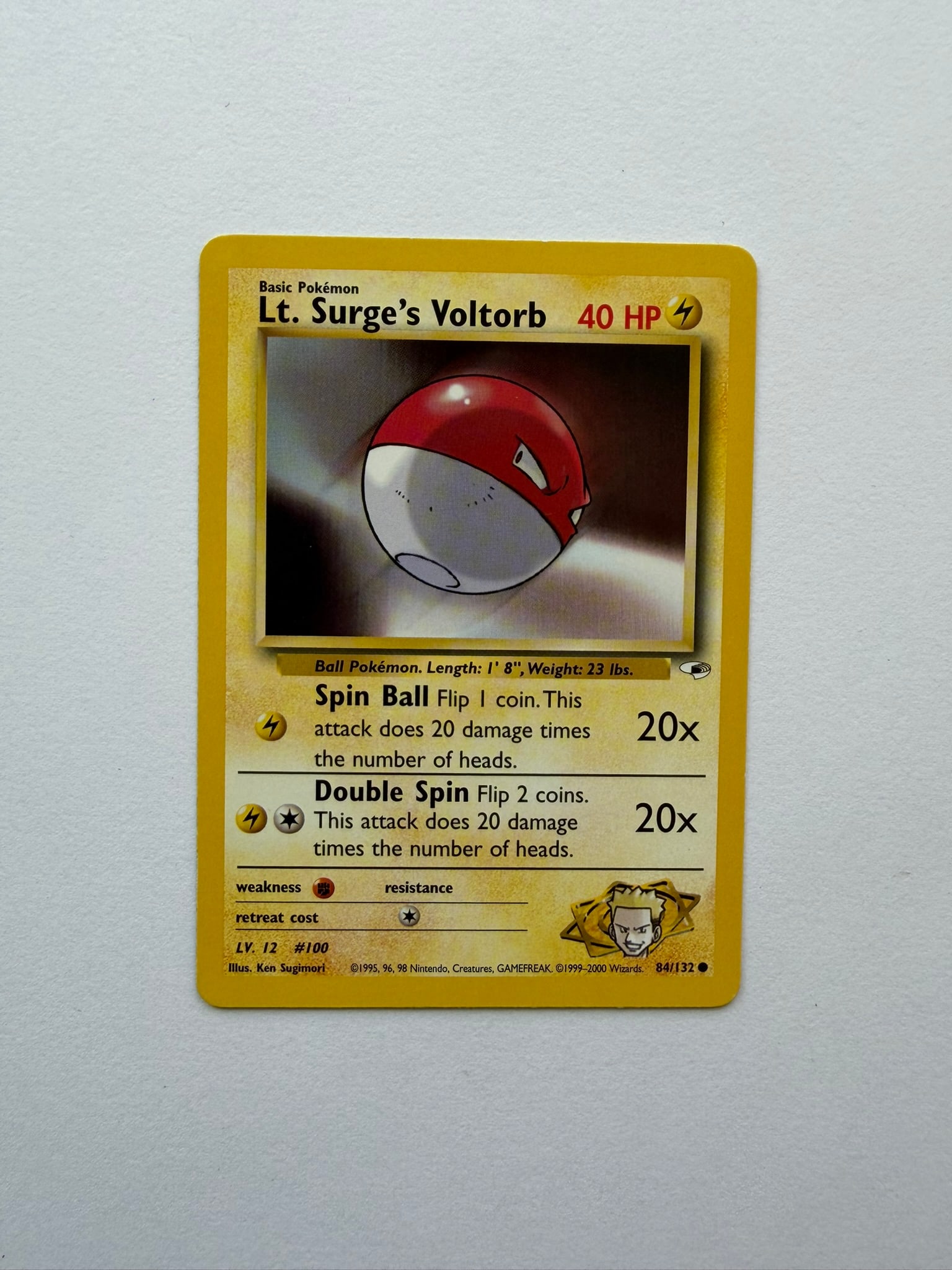 2000 Pokemon Lt. Surge's Voltorb 84/132 Gym Heroes: Lt. Surge's Voltorb 84/132 from the 2000 Pokemon Gym Heroes expansion. Unlimited non-holo common featuring classic Ken Sugimori artwork. Ungraded with visible edge and surface wear. Please review phot