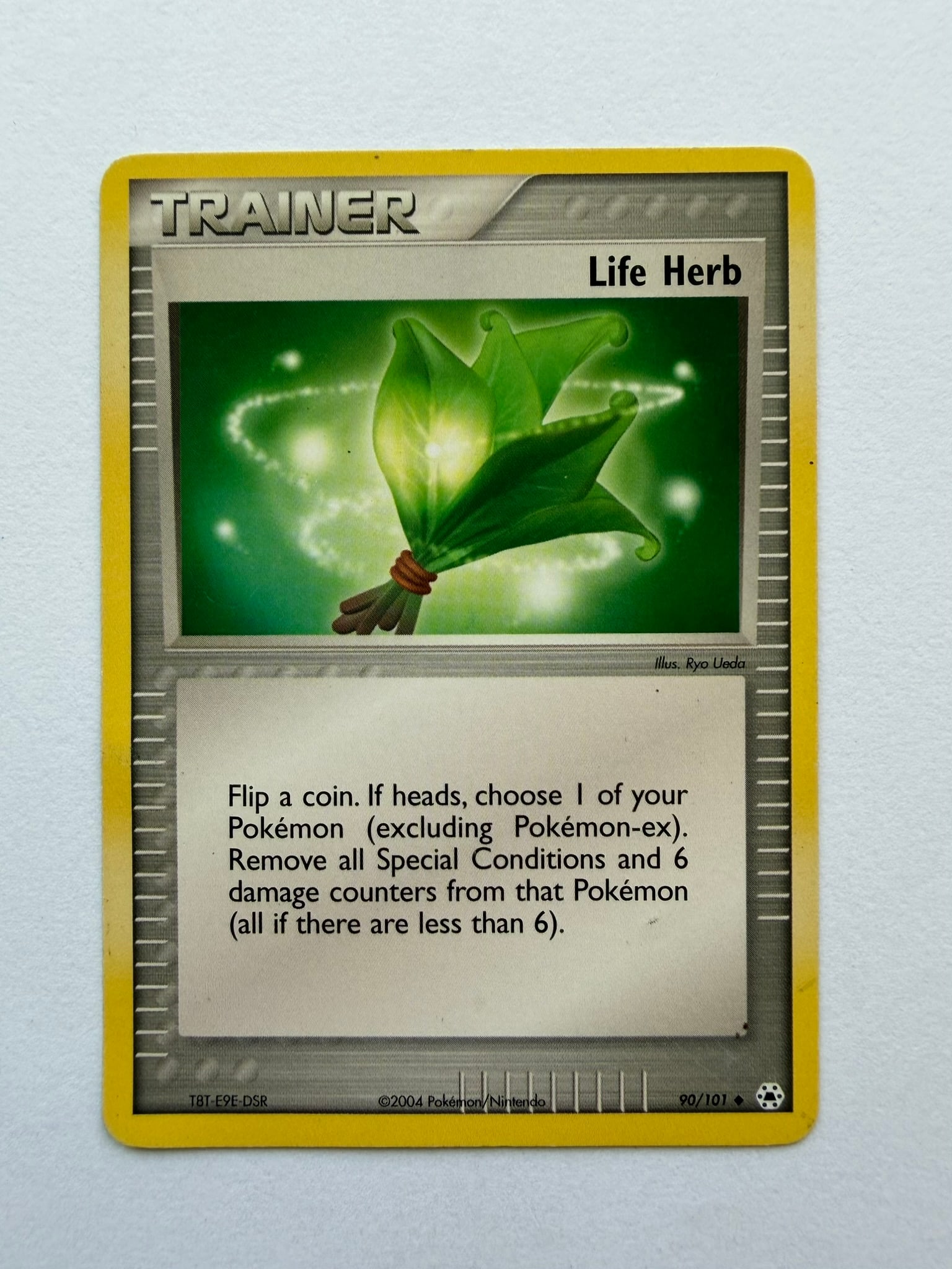 2004 Pokemon Life Herb 90/101 EX Hidden Legends: Life Herb 90/101 Trainer card from the 2004 Pokemon EX Hidden Legends expansion. Non-holo card featuring luminous artwork by Ryo Ueda. Ungraded with visible edge and surface wear. Please review photog
