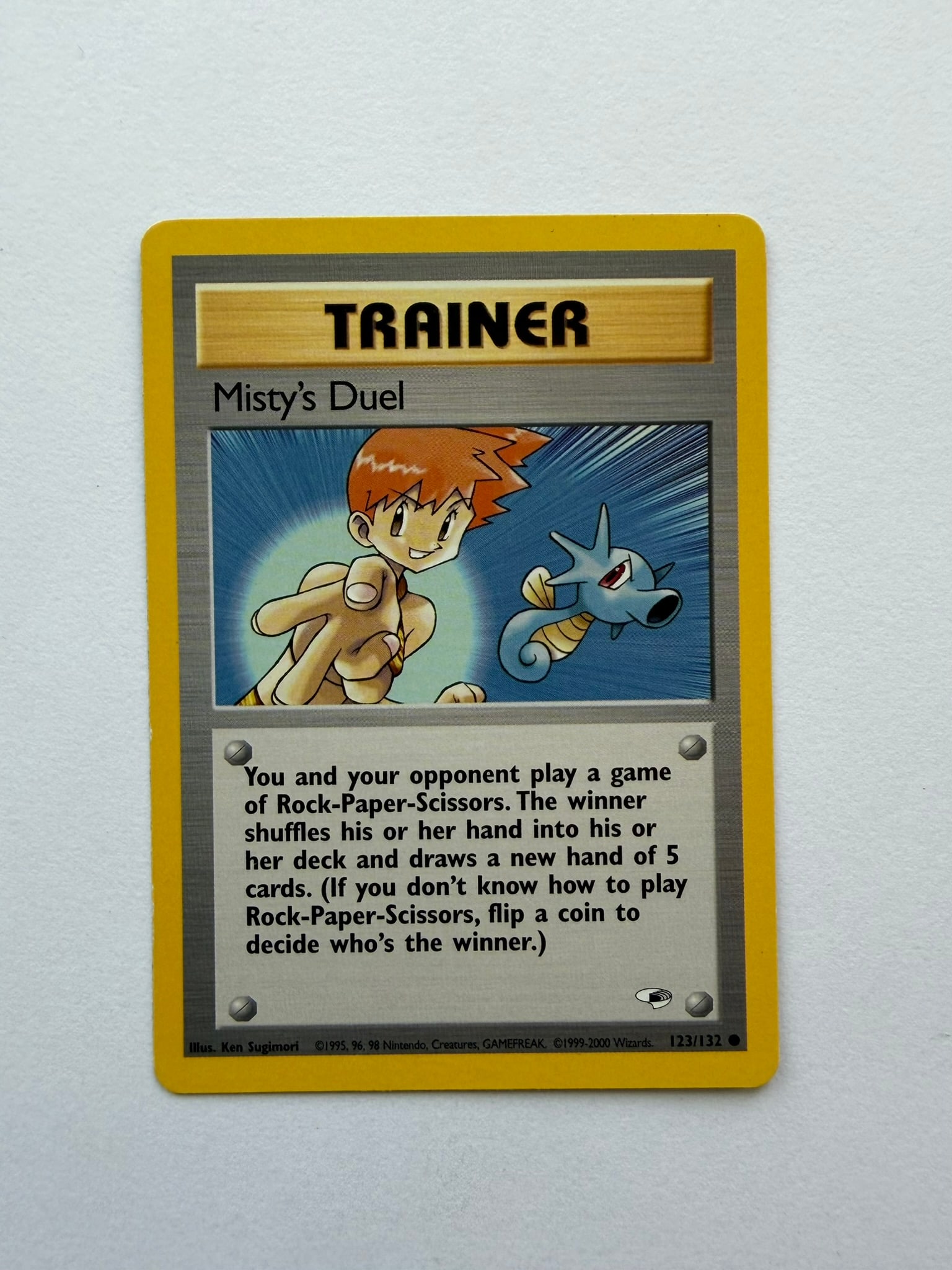 2000 Pokemon Misty's Duel 123/132 Gym Heroes: Misty's Duel 123/132 Trainer card from the 2000 Pokemon Gym Heroes expansion. Unlimited non-holo card featuring Ken Sugimori artwork. Ungraded with visible age-related edge and surface wear. Please re