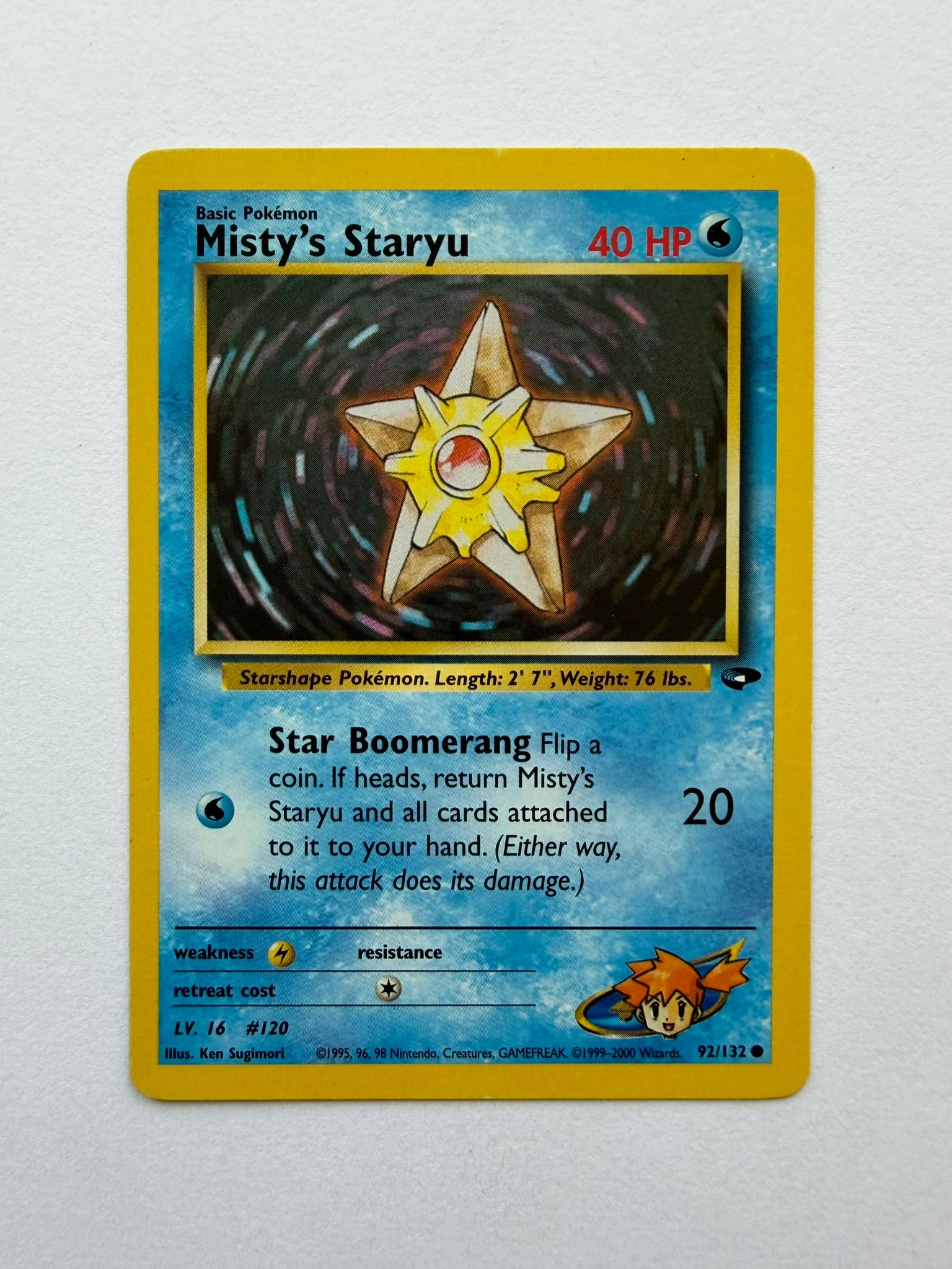 2000 Pokemon Misty's Staryu 92/132 Gym Challenge: Misty's Staryu 92/132 from the 2000 Pokemon Gym Challenge expansion. Unlimited non-holo card featuring classic Ken Sugimori artwork. Ungraded with visible age-related edge and surface wear. Please rev