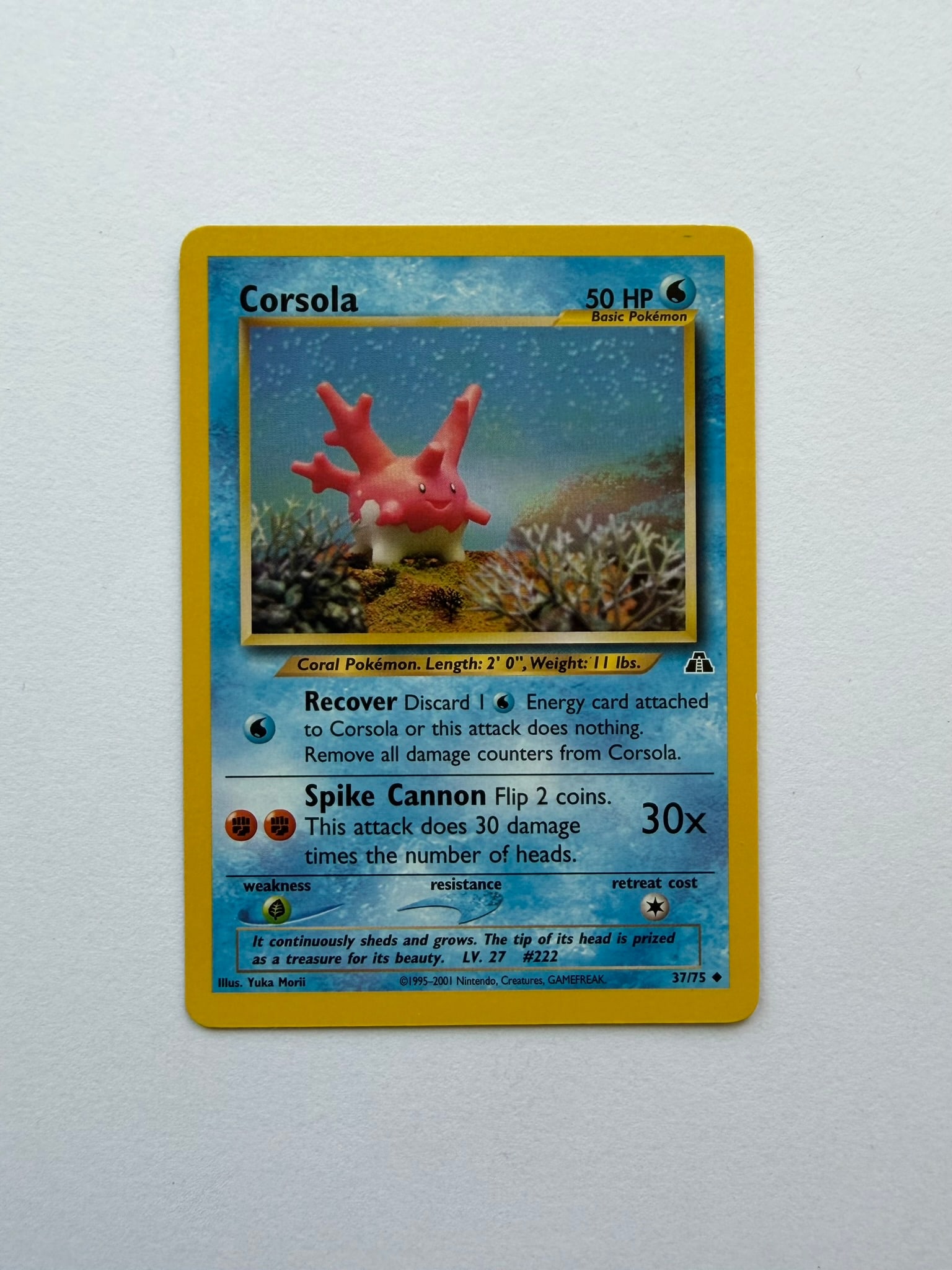 2001 Pokemon Corsola 37/75 Neo Discovery: Corsola 37/75 from the 2001 Pokemon Neo Discovery expansion. Unlimited non-holo card featuring Yuka Morii artwork. Ungraded with visible age-related edge and surface wear. Please review photographs fo