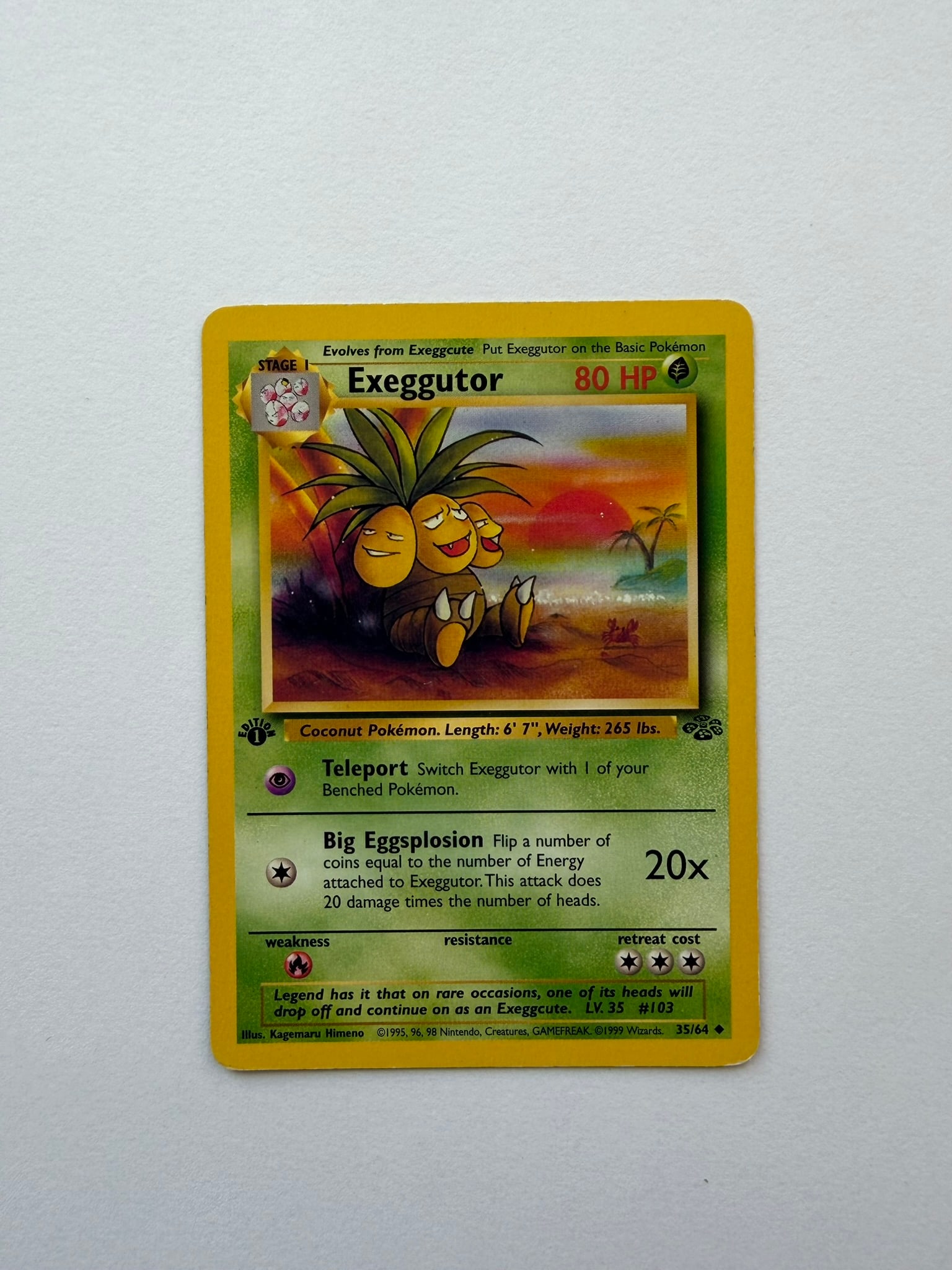 1999 Pokemon Exeggutor 35/64 Jungle 1st Edition: Exeggutor 35/64 from the 1999 Pokemon Jungle expansion. First Edition non-holo card featuring Kagemaru Himeno artwork. Ungraded with visible age-related edge and surface wear. Please review photograph