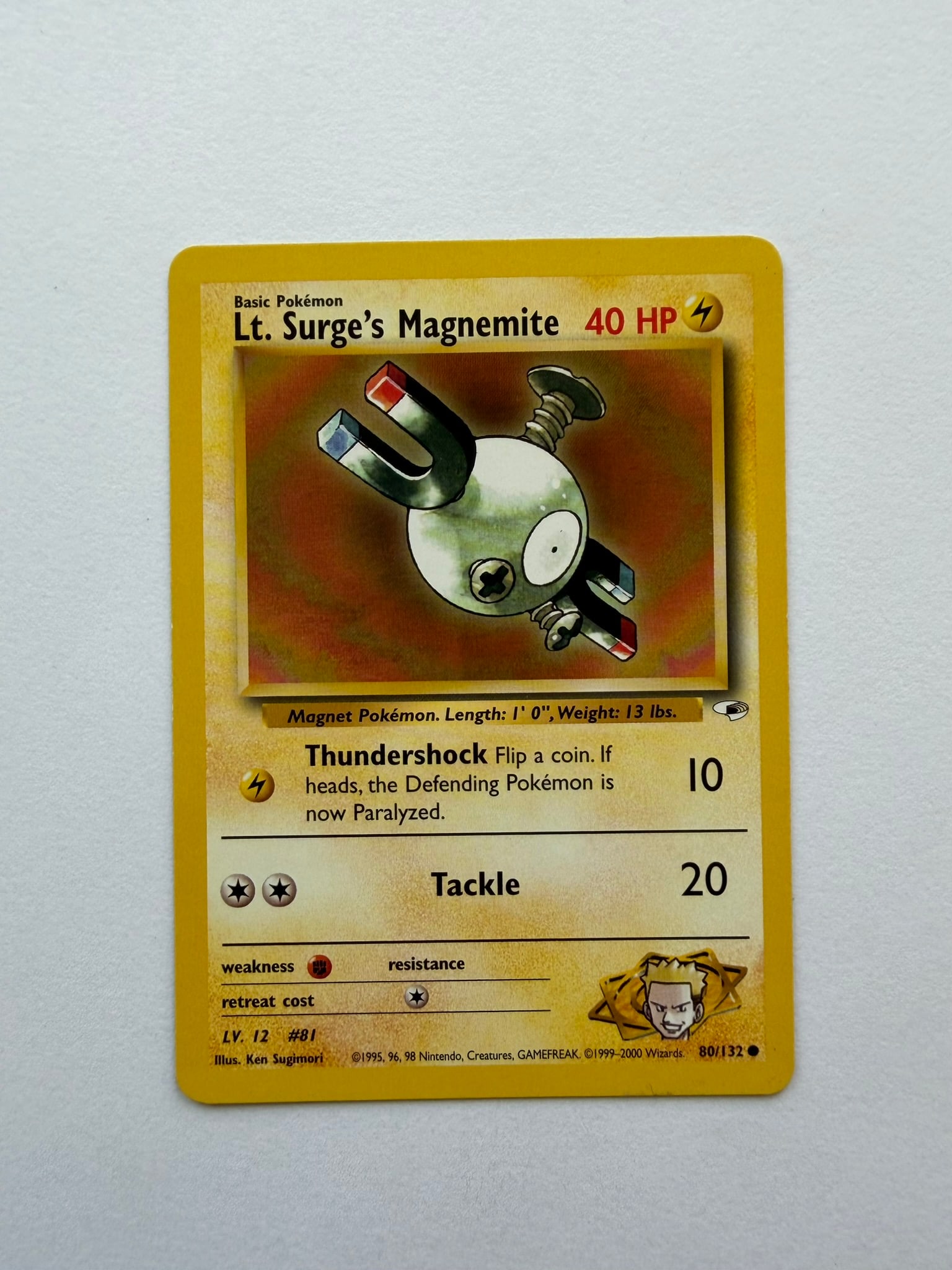 2000 Pokemon Lt. Surge's Magnemite 80/132 Gym Heroes: Lt. Surge's Magnemite 80/132 from the 2000 Pokemon Gym Heroes expansion. Unlimited non-holo card featuring Ken Sugimori artwork. Ungraded with visible age-related edge and surface wear. Please review 