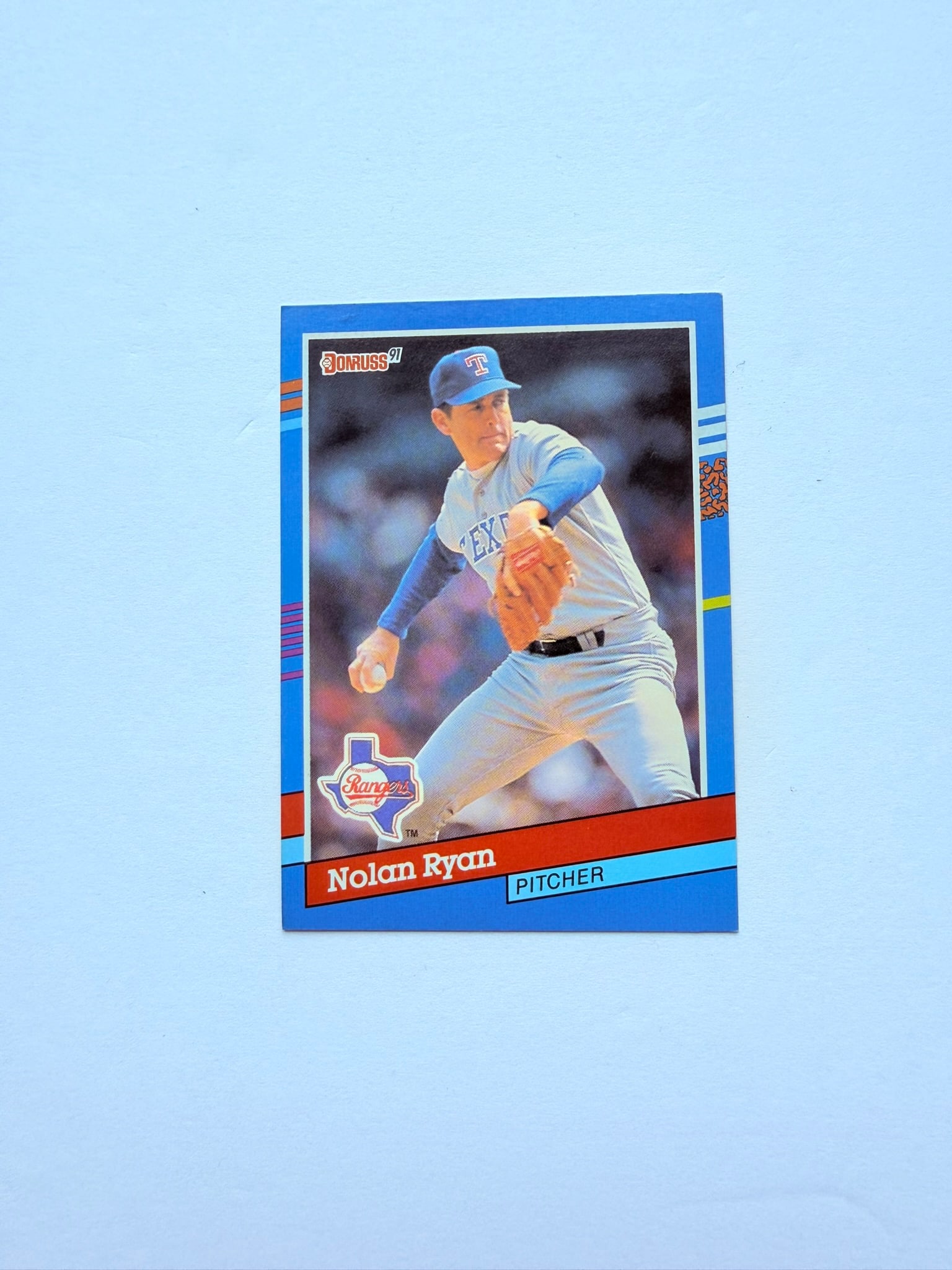 1991 Donruss Baseball #89 Nolan Ryan Texas Rangers HOF Card: 1991 Donruss #89 Nolan Ryan featuring the Hall of Fame strikeout king during his Texas Rangers years. Classic early-90s baseball card showcasing one of the greatest pitchers in MLB history. Excellent 