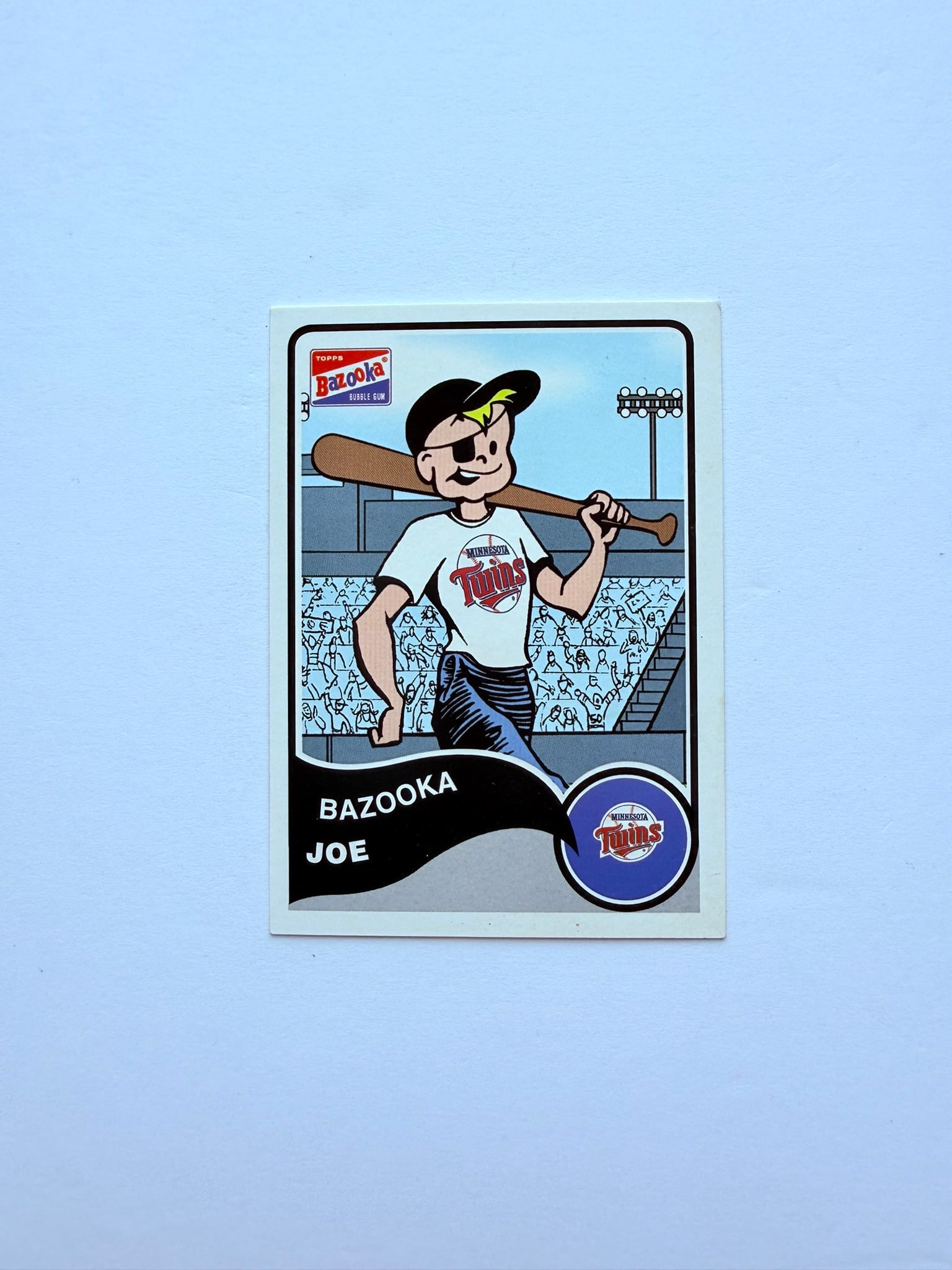 2003 Topps Bazooka Joe Minnesota Twins #7 Bazooka Joe Baseball Card: 2003 Topps Bazooka Joe Minnesota Twins #7 novelty baseball card featuring the iconic Bazooka Joe character and Twins logo. Fun collectible for baseball card, Topps, and Bazooka memorabilia collectors.