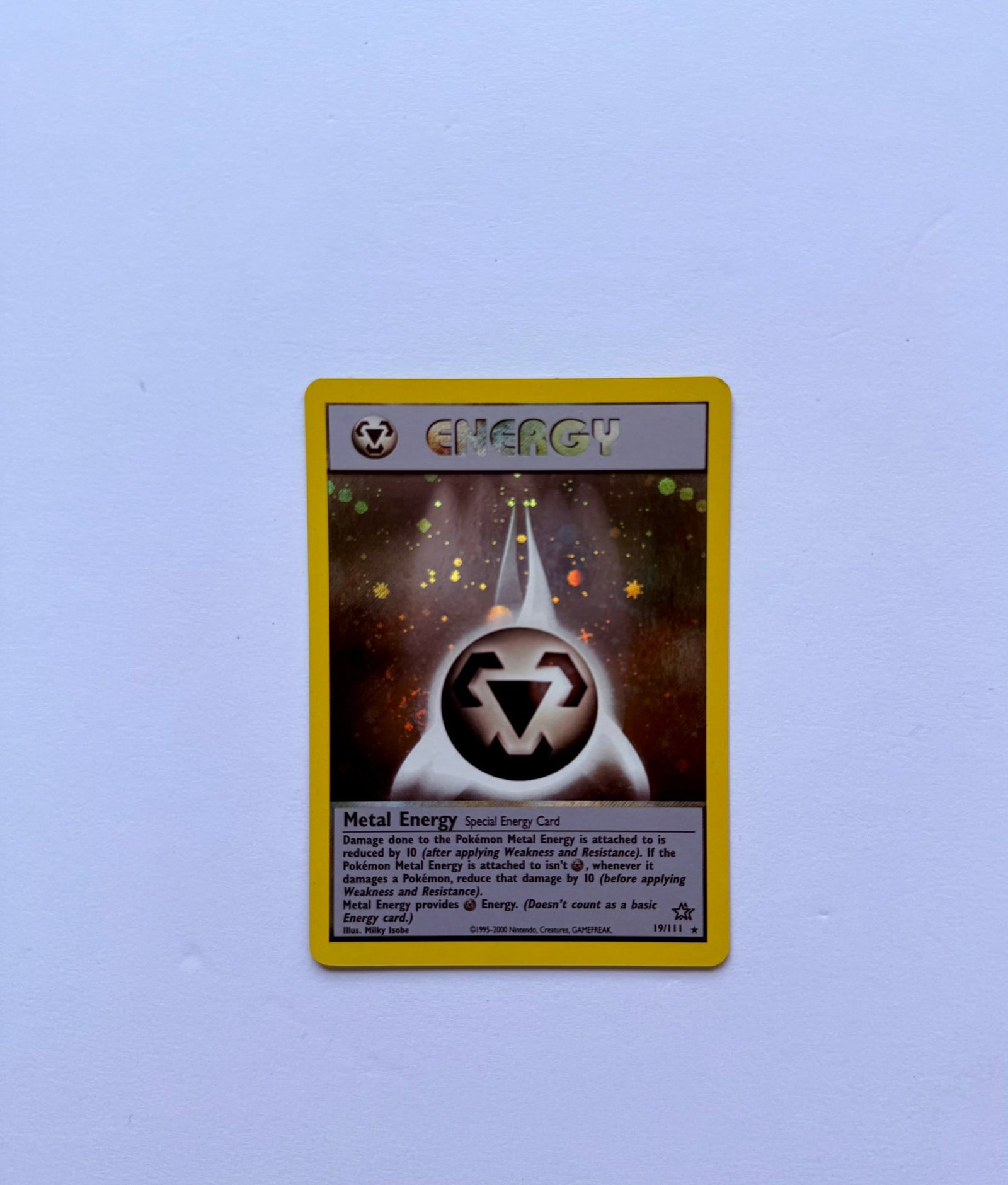 Metal Energy 19/111 Neo Genesis Holo Pokemon Card: Metal Energy 19/111 holo Pokémon card from the Neo Genesis set. Card is in Near Mint condition. Please see photos for overall condition before bidding.