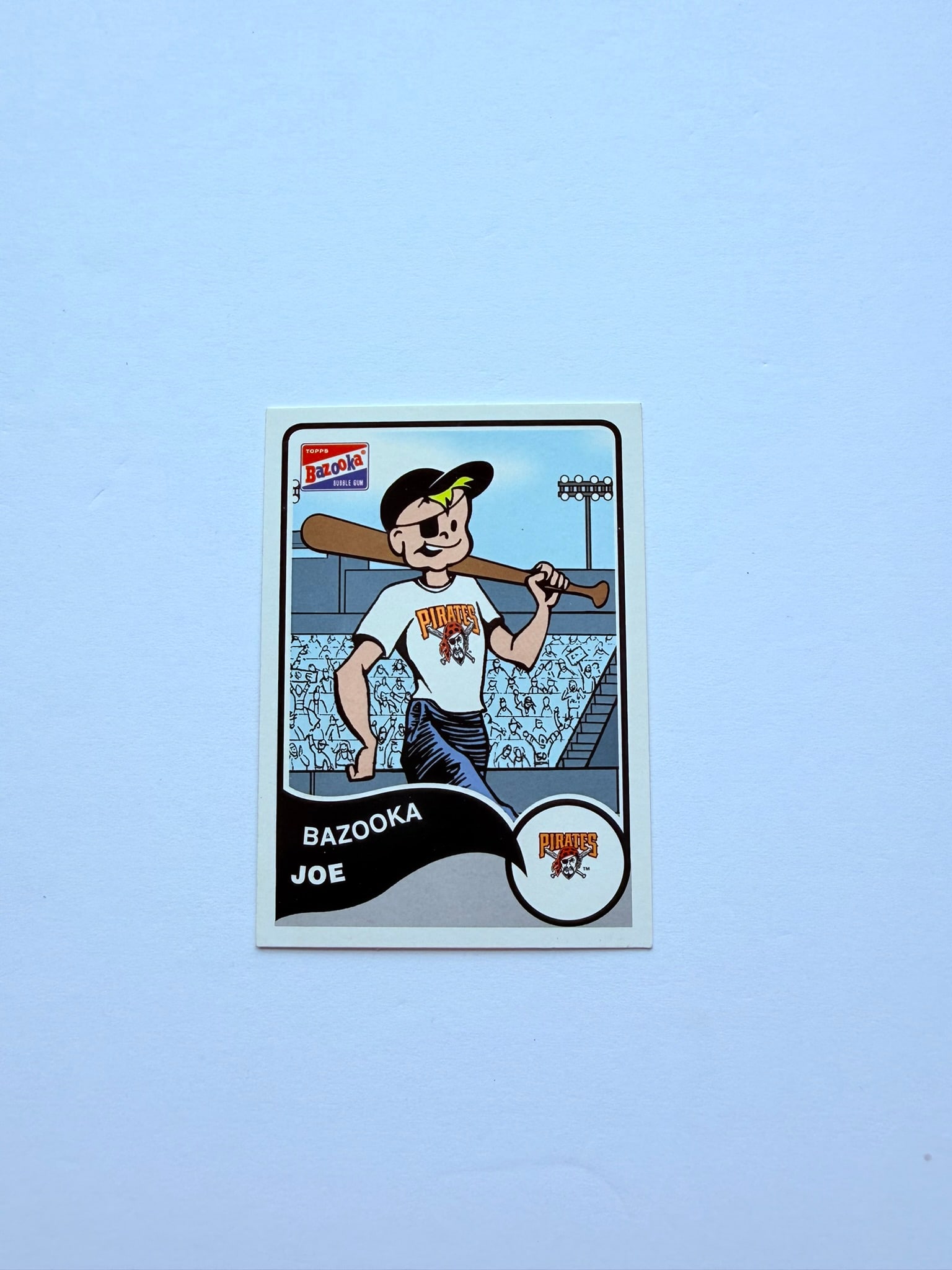 2003 Topps Bazooka Joe Pittsburgh Pirates #7 Bazooka Joe Baseball Card: 2003 Topps Bazooka Joe Pittsburgh Pirates #7 novelty card showcasing Bazooka Joe and Pirates team graphics. Great addition for Pirates fans, Bazooka collectors, and unique baseball card enthusiasts.