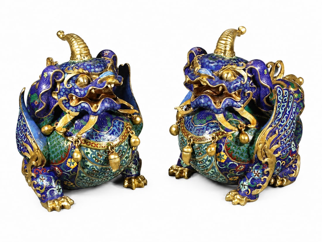 Pair of Qianlong-Marked Enameled Porcelain Pixiu Statues: Pair of Qianlong-Marked Enameled Porcelain Pixiu Statues. This finely crafted Chinese decorative work features traditional motifs and detailed handwork in Porcelain. The composition reflects the symbo