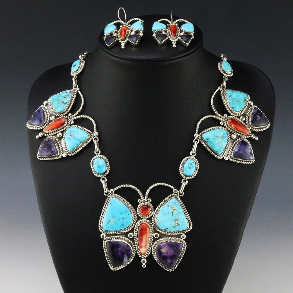 Diane Lonjose Zuni Butterfly Turquoise Necklace and Earrings Set: Zuni butterfly necklace and matching earrings set by Diane Lonjose. The hand-fabricated sterling silver jewelry features natural Kingman Turquoise, Spiny Oyster, Mexican Opal, and purple stone inlay a