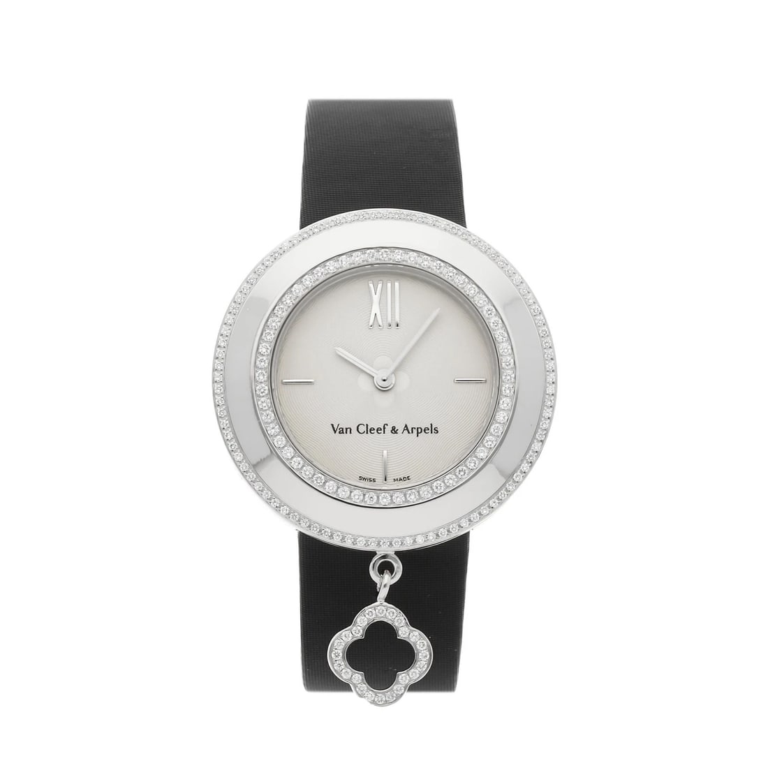 Van Cleef & Arpels Diamond Charm Watch 18K White Gold VCAR029A00: Van Cleef & Arpels Charm Mini quartz watch featuring a 32 mm 18k white gold case, silver-tone dial, diamond-set bezel, black strap, and a diamond-set clover-shaped charm. The dial displays hours and m