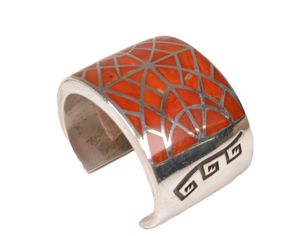 Heavy Navajo Sterling Silver and Coral Channel Inlay Wide Cuff Bracelet: Dimensions: W 1.625 in. Heavy Navajo Wide Cuff Bracelet, Sterling Silver and Coral Channel Inlay Late 20th Century 5 in x 1.25 in Gap x 1.625 in W Excellent Condition 5224-0596 Will this bracelet fit 