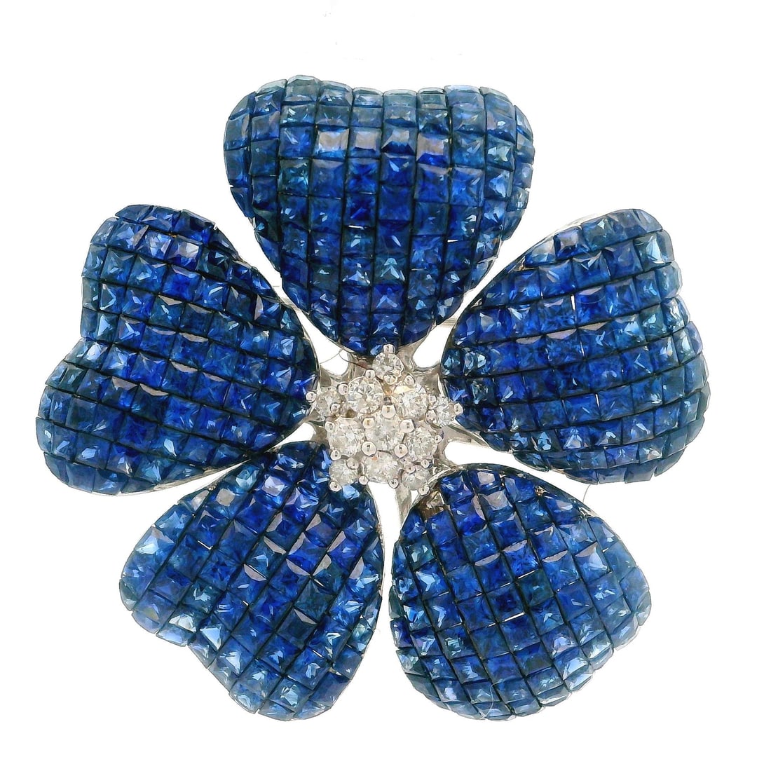 18K White Gold Sapphire and Diamond Flower Brooch Pendant: Floral brooch pendant crafted in 18K solid white gold and set with numerous natural sapphires in square step-cut and calibre-cut stones arranged in an invisible mystery setting. The sapphires display 