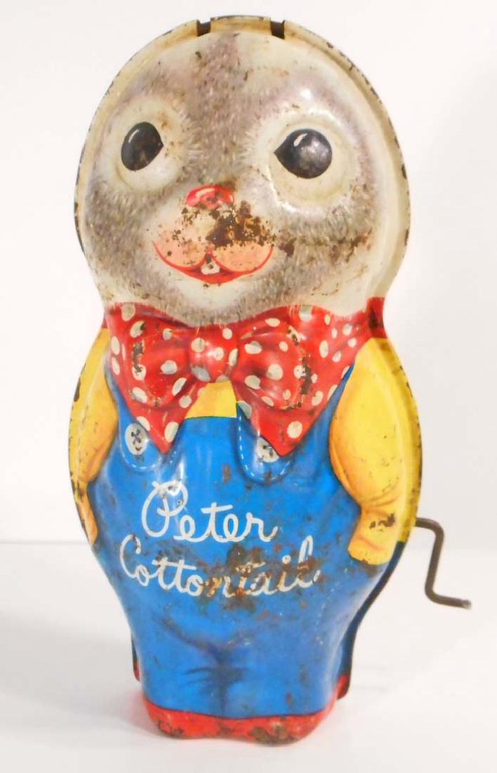 VINTAGE PETER COTTONTAIL TIN LITHO WIND-UP MUSICAL TOY: Music does not play and he needs his ears replaced. 8" tall