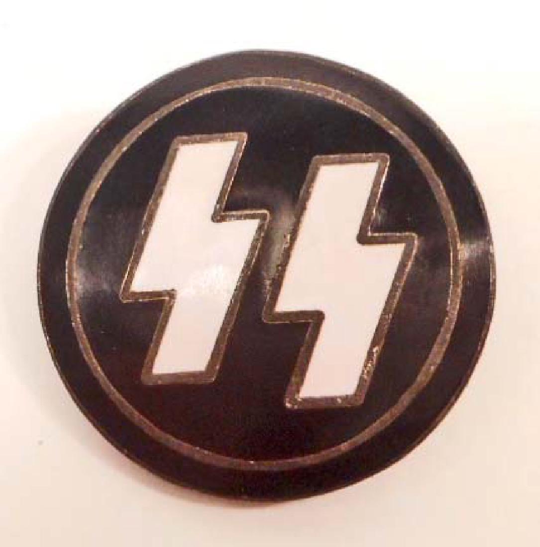 GERMAN NAZI WAFFEN SS PARTY MEMBER BADGE: Measures 7/8" in diameter. Maker marked 'RZM M1/122'. Pin back. Nickel construction with enamel