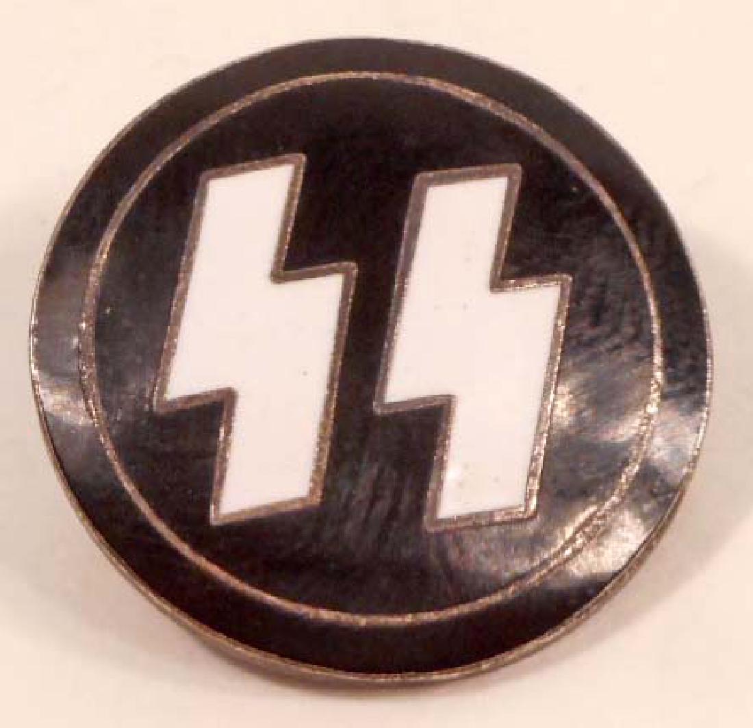 GERMAN NAZI WAFFEN SS RUNIC MEMBERSHIP BADGE: Measures 1 7/8" in diameter. The reverse side is maker marked 'RZM M1/122'. Has a thin horizontal pin back. Nickel construction with enamel.
