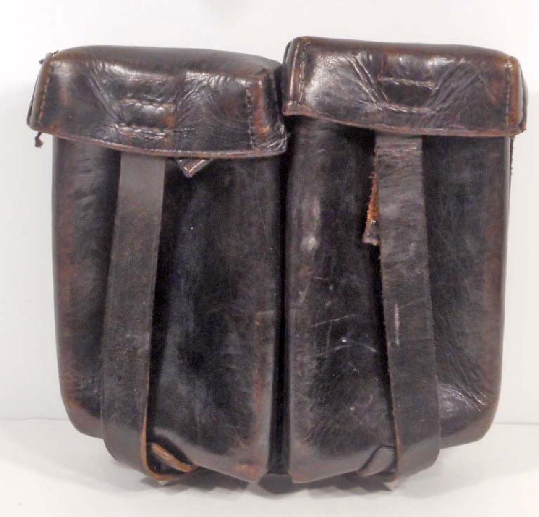 GERMAN NAZI WAFFEN SS LEATHER MACHINE GUN CLIP HOLDER: Measures 7 1/2" wide by 6 3/4" tall. The reverse side is maker marked 'Max Stelzer 58 Berlin SS'. Hold Two (2) MG clips. Black leather machine sewn construction.