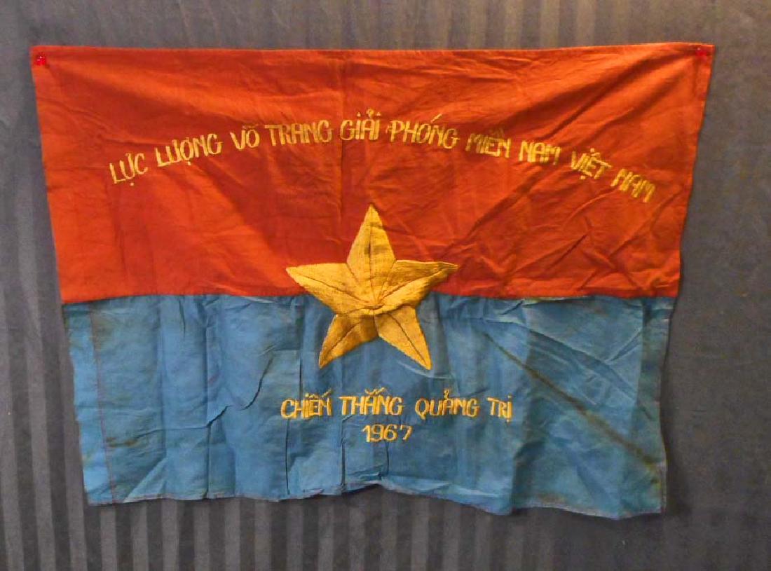 NORTH VIET NAM ERA VIET CONG VC REGIMENTAL COMBAT FLAG: Measures 28 3/8" wide by 21" tall. The front reads 'Luc Luong Vo Trang Giai Phong Mien Nam Viet Nam Chien Thang Quang Tri 1967'. Has an embroidered yellow Five (5) armed star in the center. Two piece 