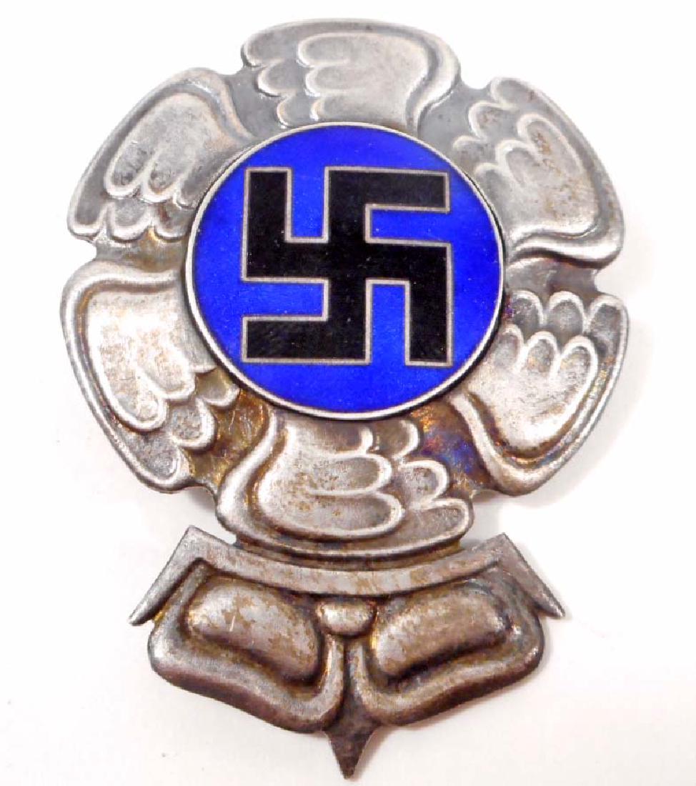 GERMAN FINLAND NAZI LUFTWAFFE SWASTIKA COMBAT BREAST: Measures 1 3/4" wide by 2 3/8" tall. Has a screw mount post and nut on the reverse side. Two piece nickel construction with enamel.